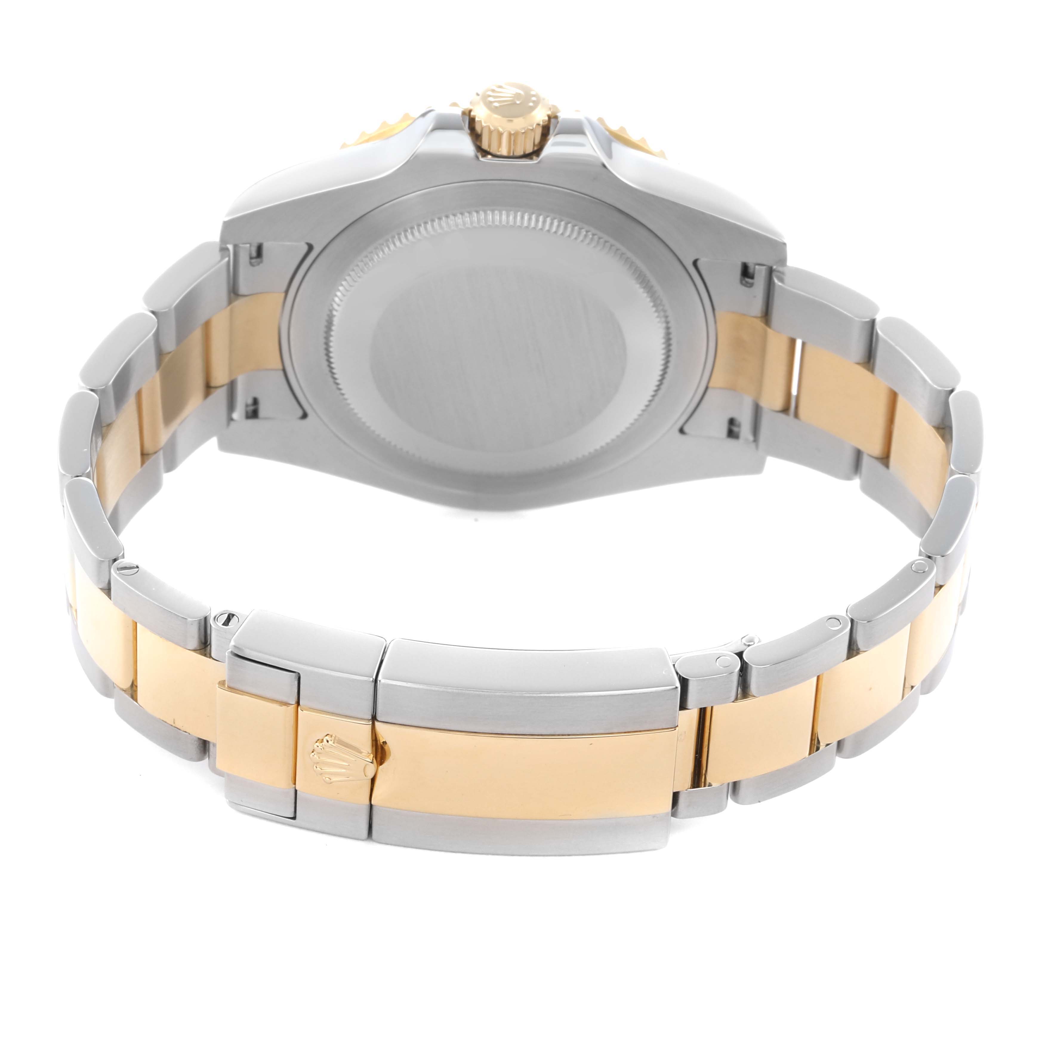 The image shows the back view of a Rolex GMT-Master 116713 Men
s Steel and Gold (two tone) Black Dial 116713 Men
s Steel and Gold (two tone) Black Dial with its stainless steel and gold bracelet and closed clasp.