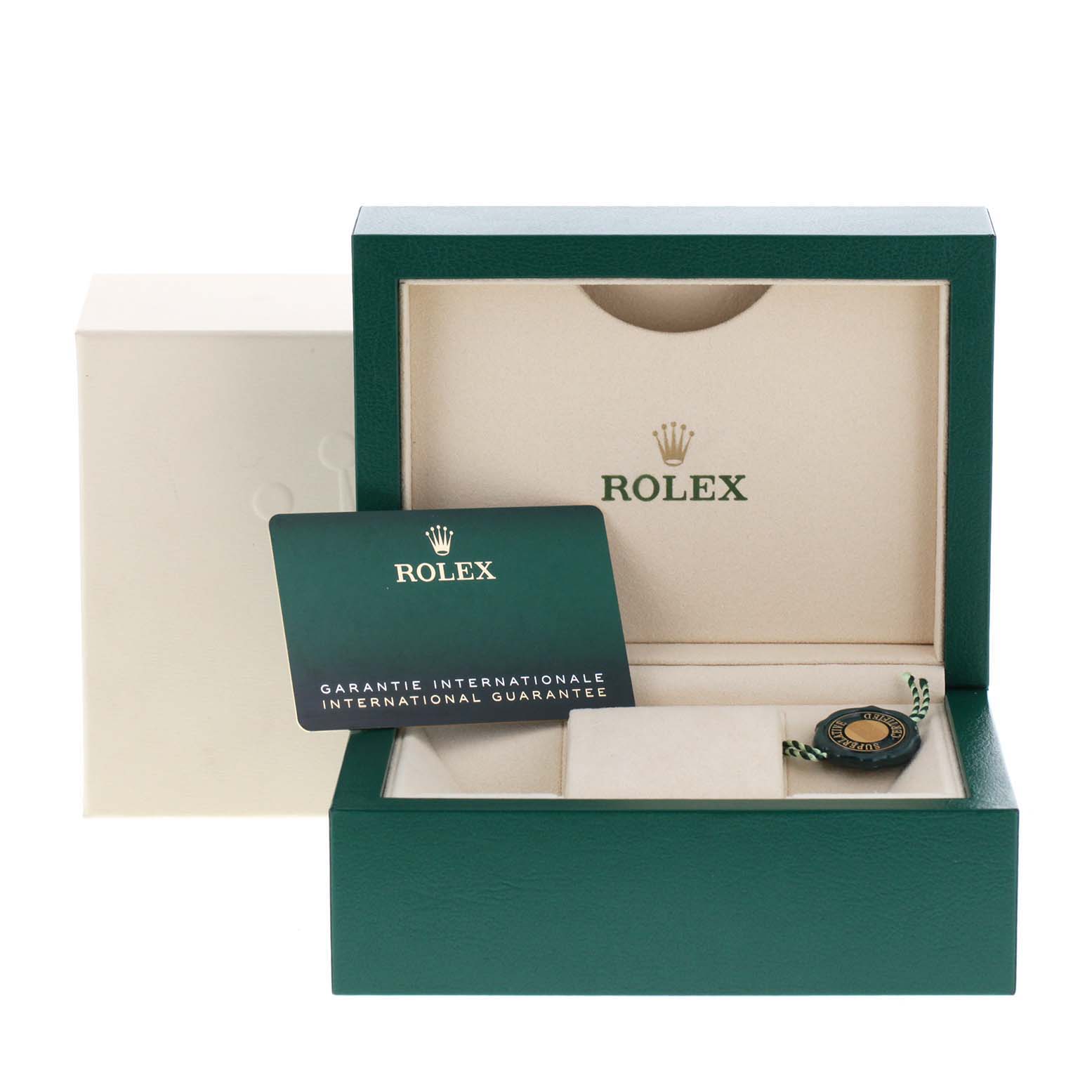 The image shows a Rolex Mid-Size 277200 Women
s Stainless Steel Blue Dial 277200 Women
s Stainless Steel Blue Dial watch box, international guarantee card, and a tag.