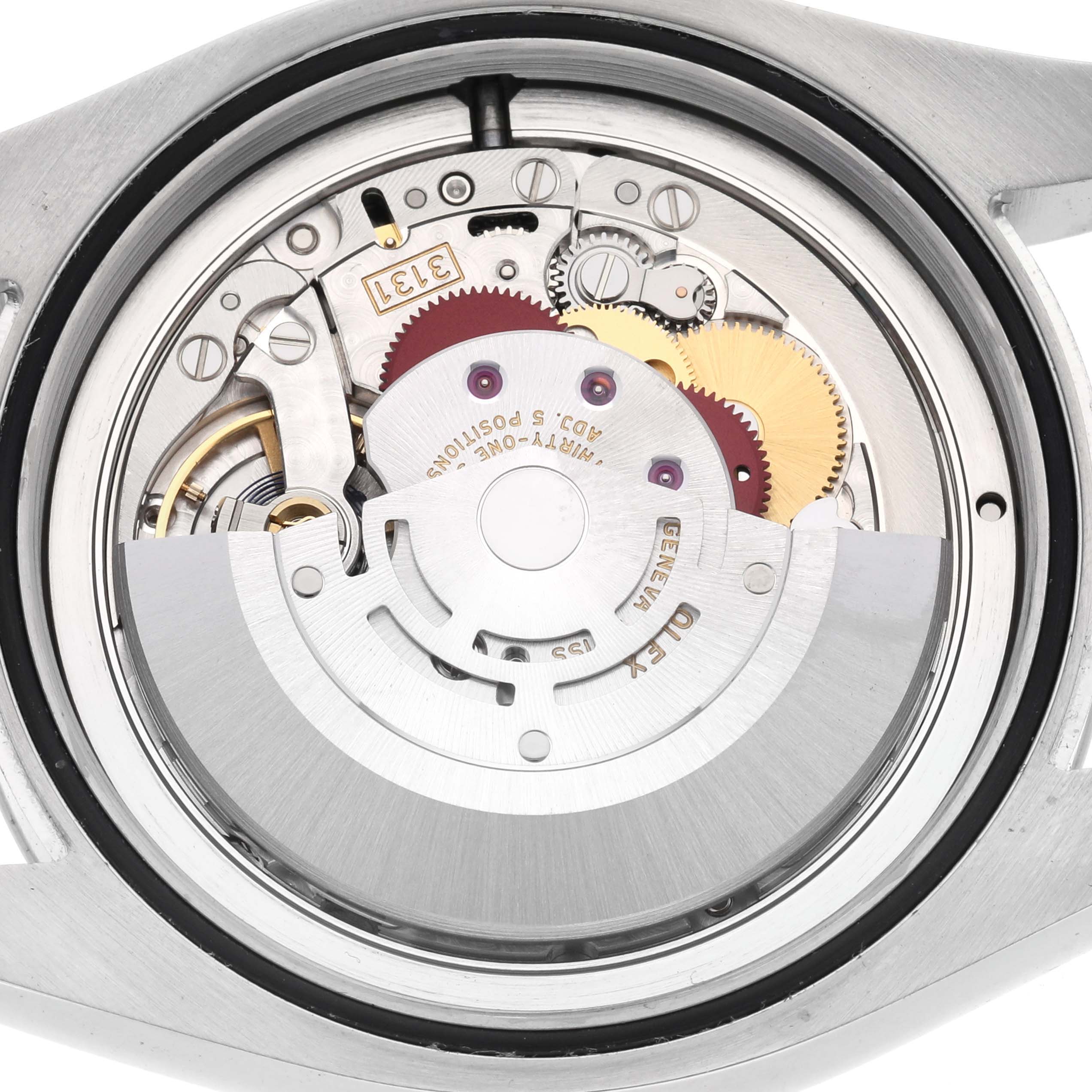 The image shows the movement of a Rolex Milgauss 116400GV Men
s Stainless Steel Black Dial 116400GV Men
s Stainless Steel Black Dial watch viewed from the back, highlighting gears and the rotor.