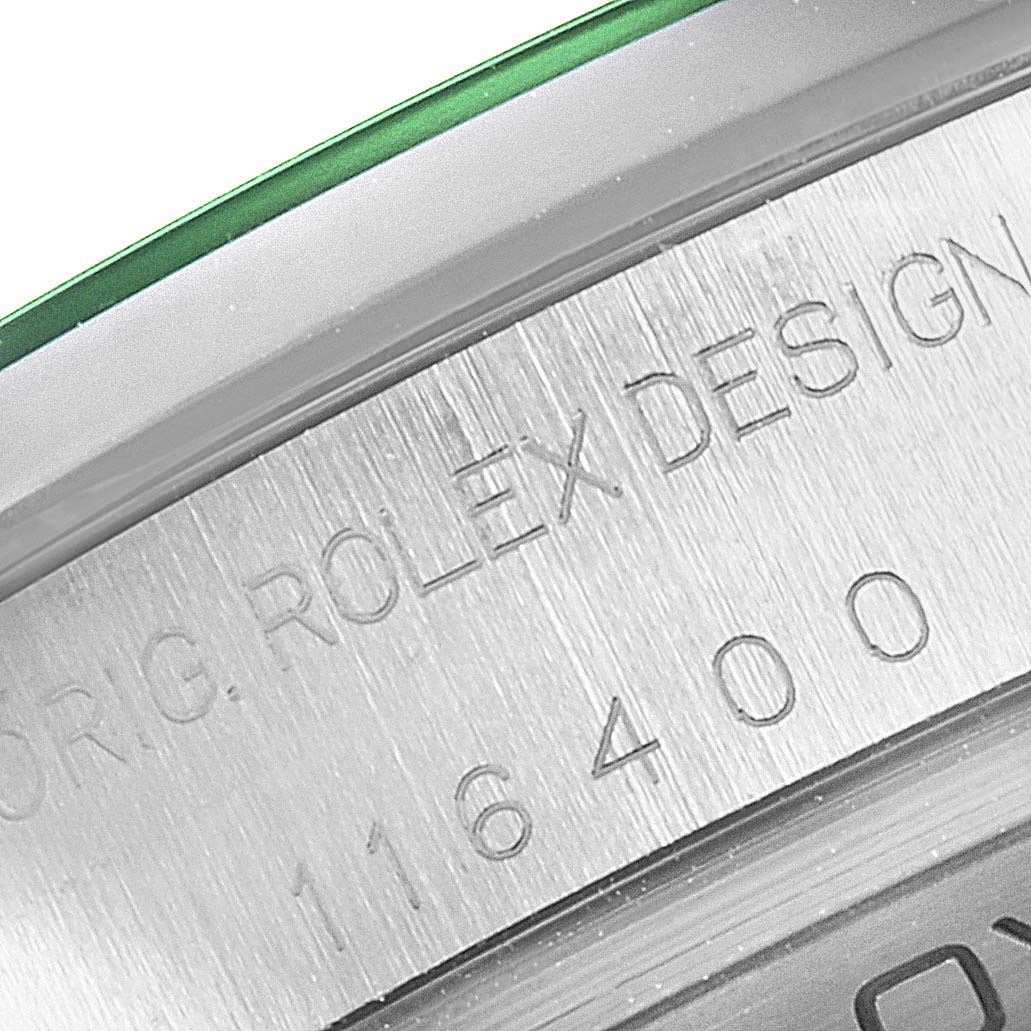 This close-up image shows part of the bezel and the engraved model number 116400 on the Rolex Milgauss 116400V Men's Stainless Steel Black Dial 116400V Men's Stainless Steel Black Dial watch.