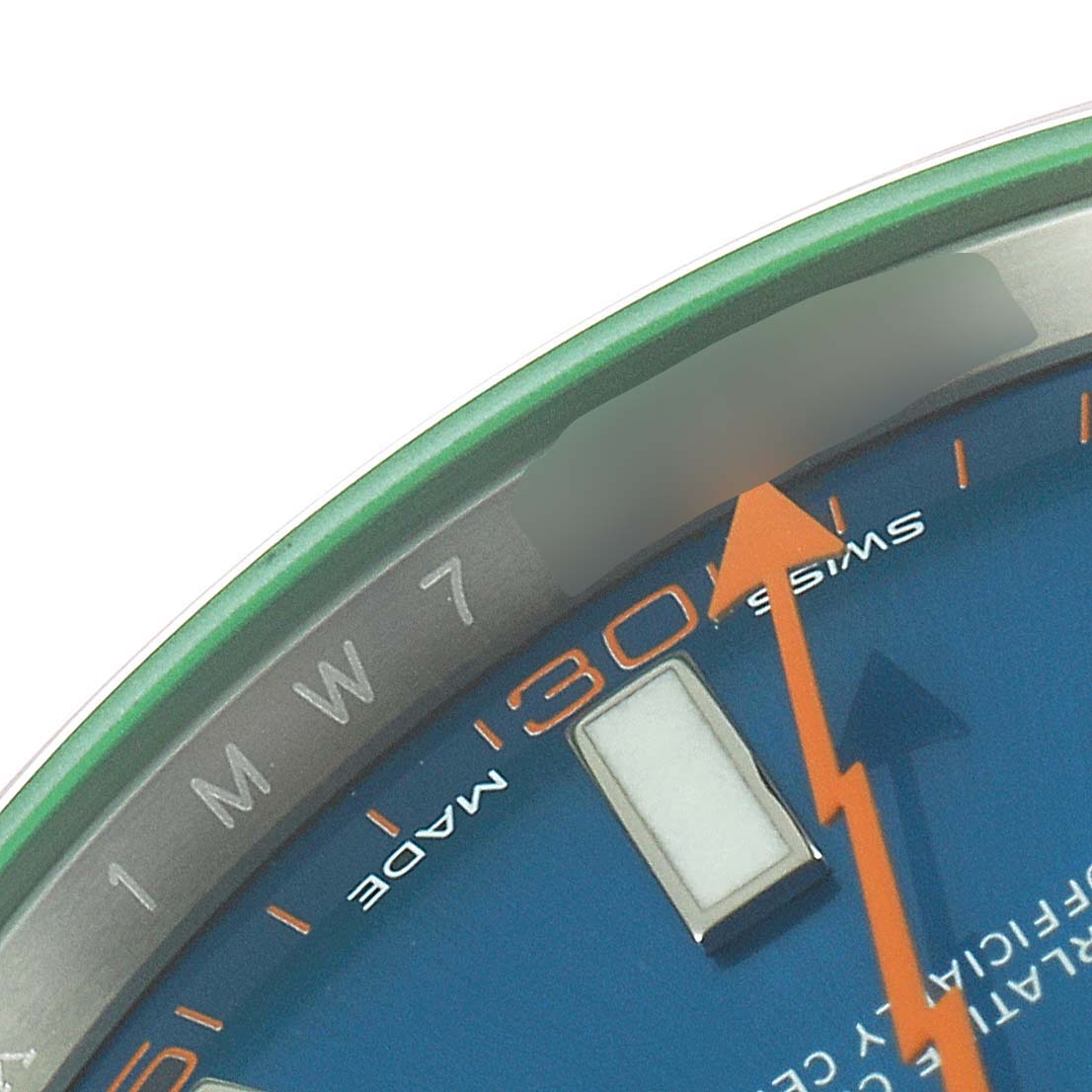 The image shows a close-up of the dial edge and orange seconds hand of a Rolex Milgauss 116400GV Men
s Stainless Steel Blue Dial 116400GV Men
s Stainless Steel Blue Dial watch.