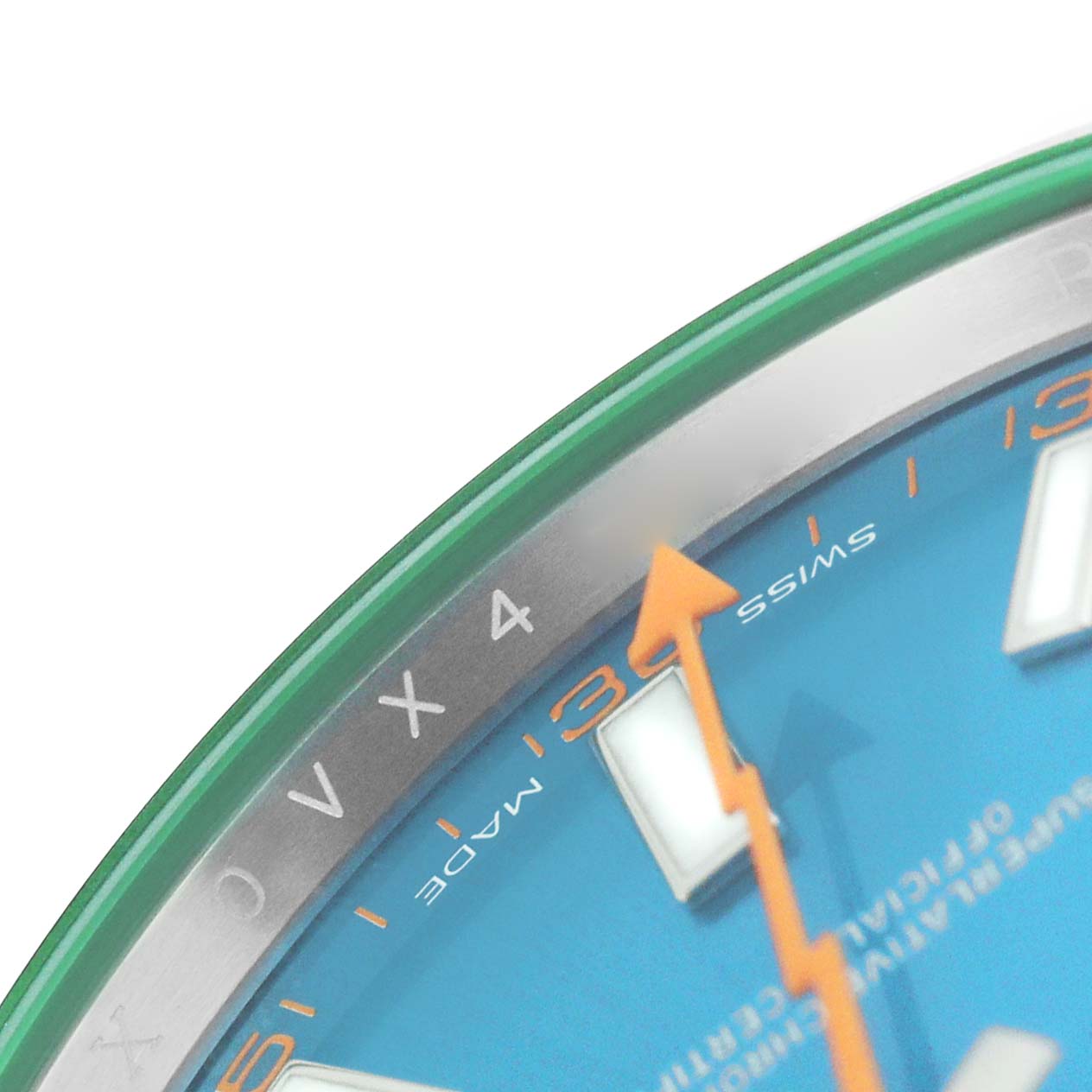 The image shows a close-up of the Rolex Milgauss M116400GV Men's Stainless Steel Blue Dial watch face, highlighting the green edge, blue dial, part of the orange lightning bolt hand, and indices.