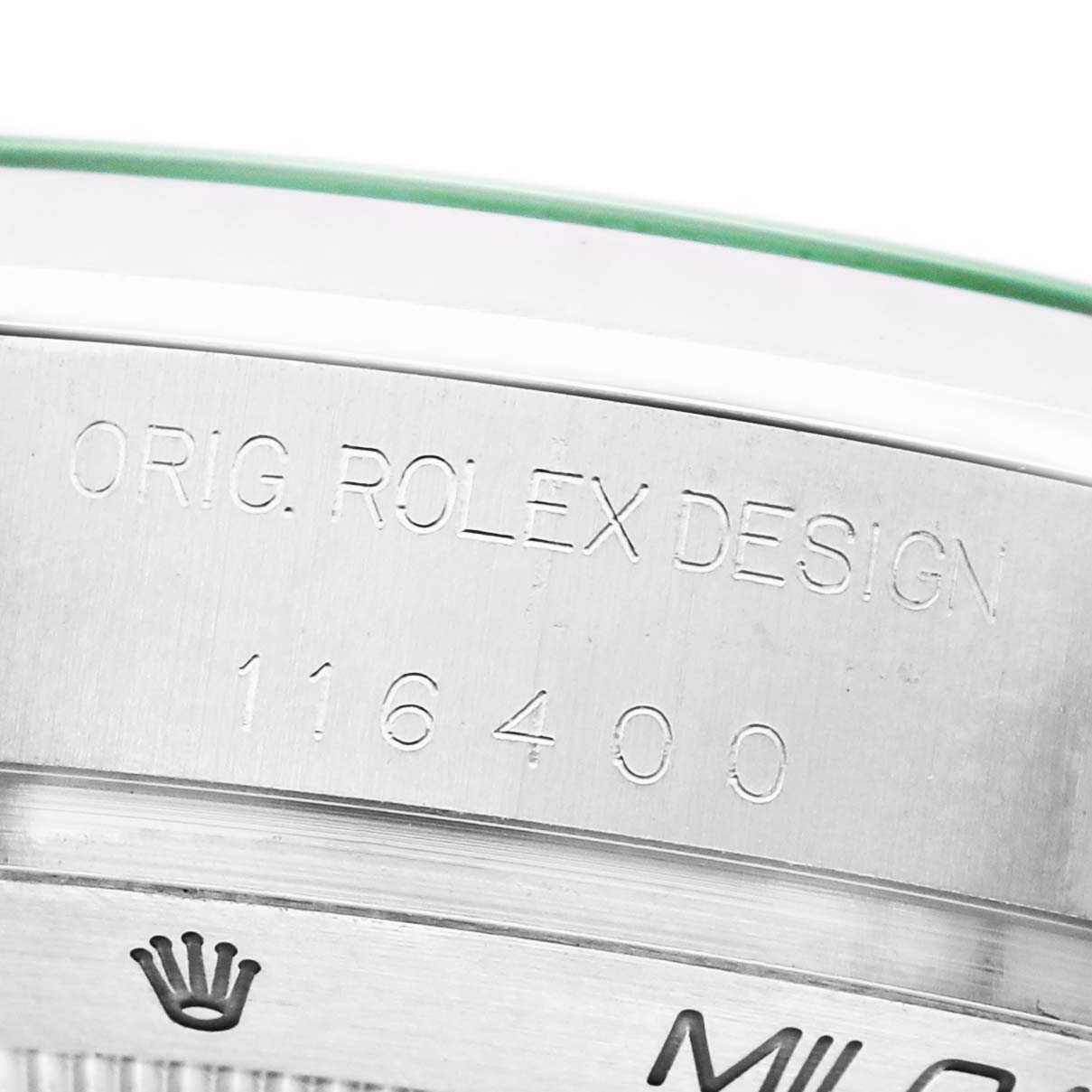 The image shows a close-up of the Rolex Milgauss M116400GV Men's Stainless Steel Blue Dial model's engraved side, displaying the model number and brand name.