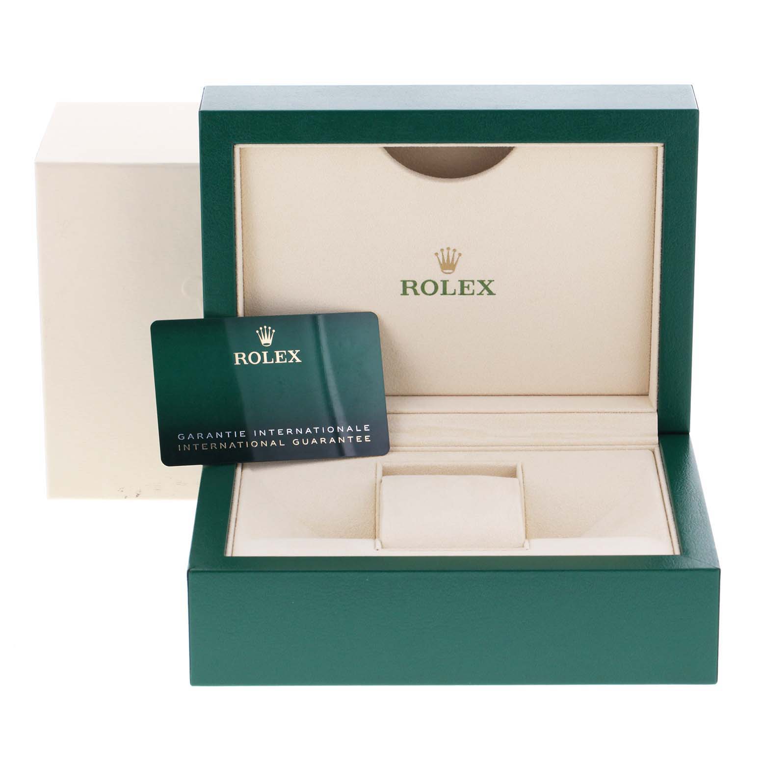 The image shows an open green Rolex box for the Oyster Perpetual model, with an international guarantee card inside.