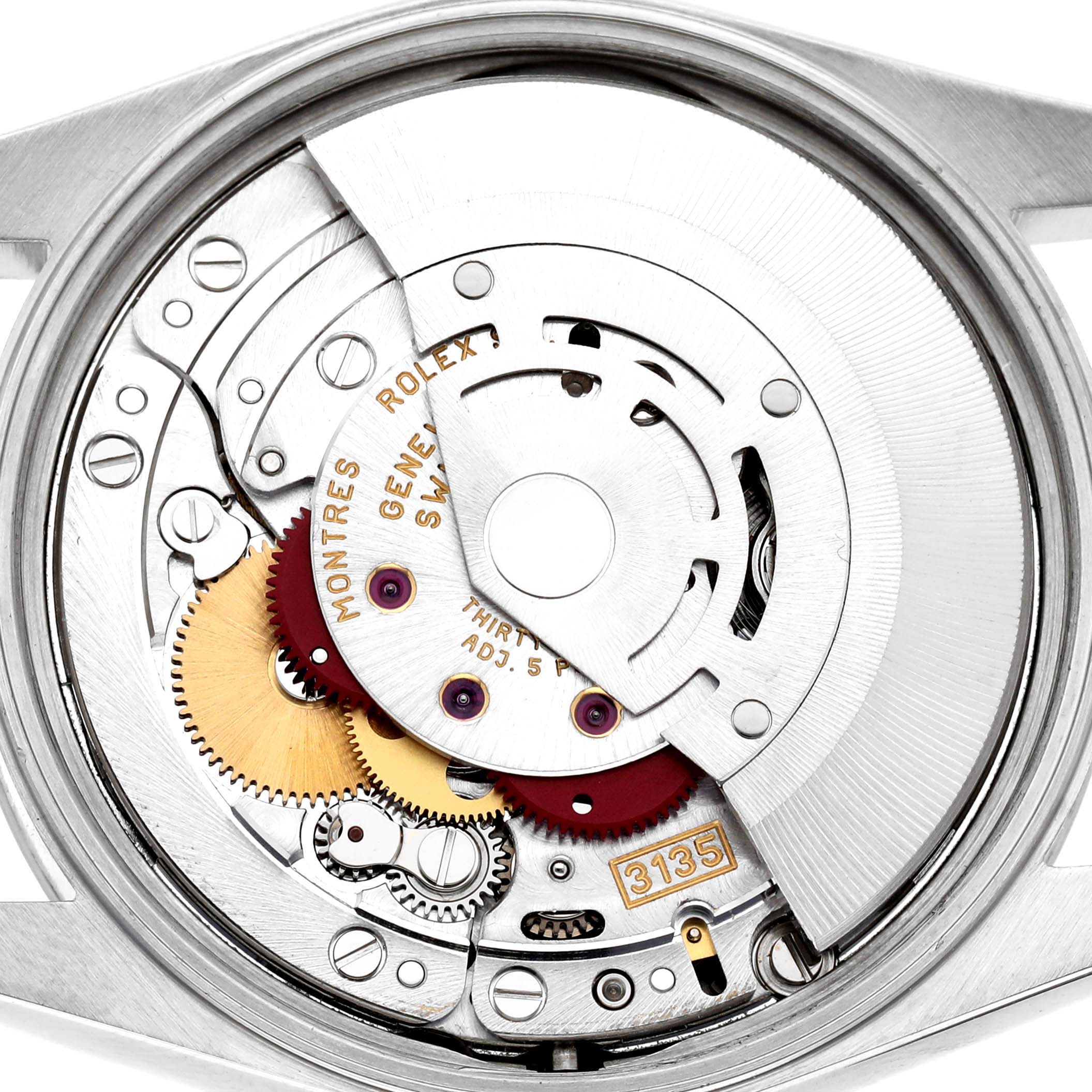The image shows the inner mechanism of a Rolex Oyster Perpetual 15200 Men's Stainless Steel Black Dial, focusing on the movement components from the back.
