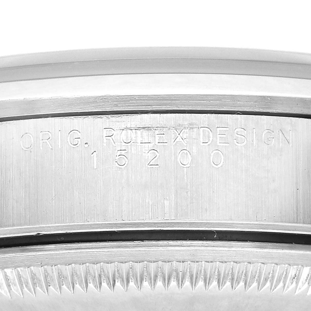 The image shows a close-up view of the engraved side detailing on a Rolex Oyster Perpetual 15200 Men's Stainless Steel Black Dial watch, highlighting the model number.