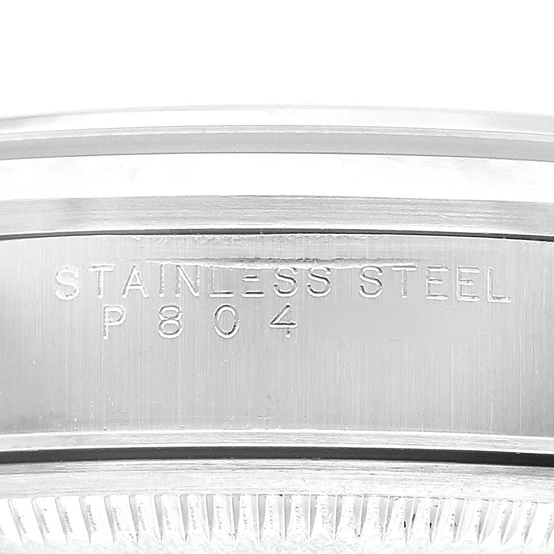 The image shows a close-up of the engravings on the stainless steel case back of a Rolex Date 15200 Men's Stainless Steel Black Dial model watch.