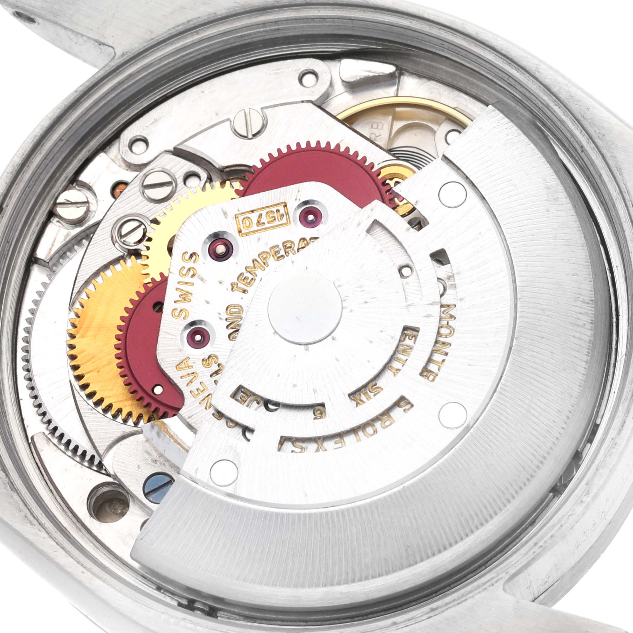 The image shows the inner mechanism of a Rolex Oyster Perpetual 1007 Men
s Stainless Steel Silver Dial 1007 Men
s Stainless Steel Silver Dial watch, highlighting gears and components from a top-down angle.