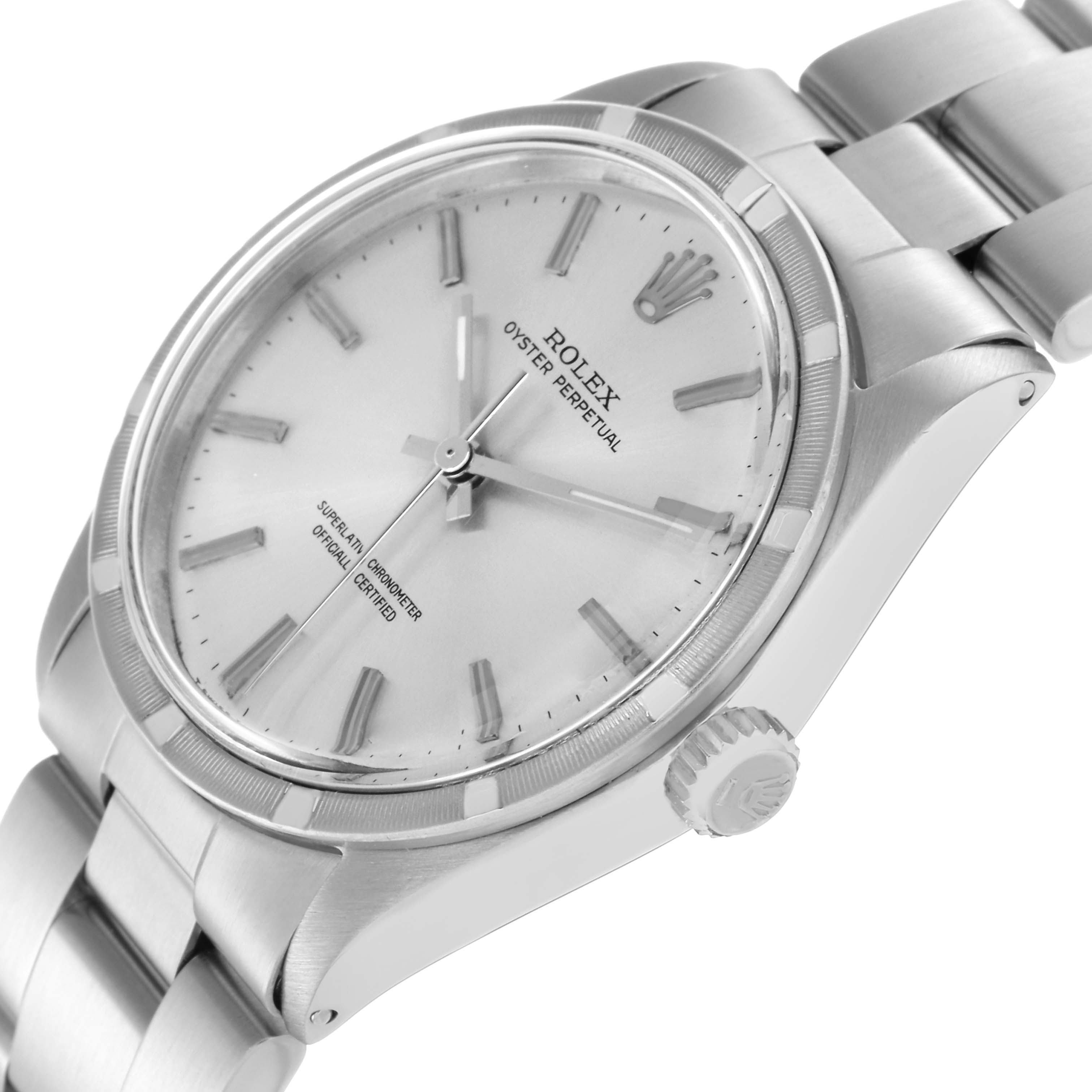 The Rolex Oyster Perpetual 1007 Men
s Stainless Steel Silver Dial 1007 Men
s Stainless Steel Silver Dial watch is shown at a three-quarter angle, highlighting the dial, bezel, crown, and part of the bracelet.