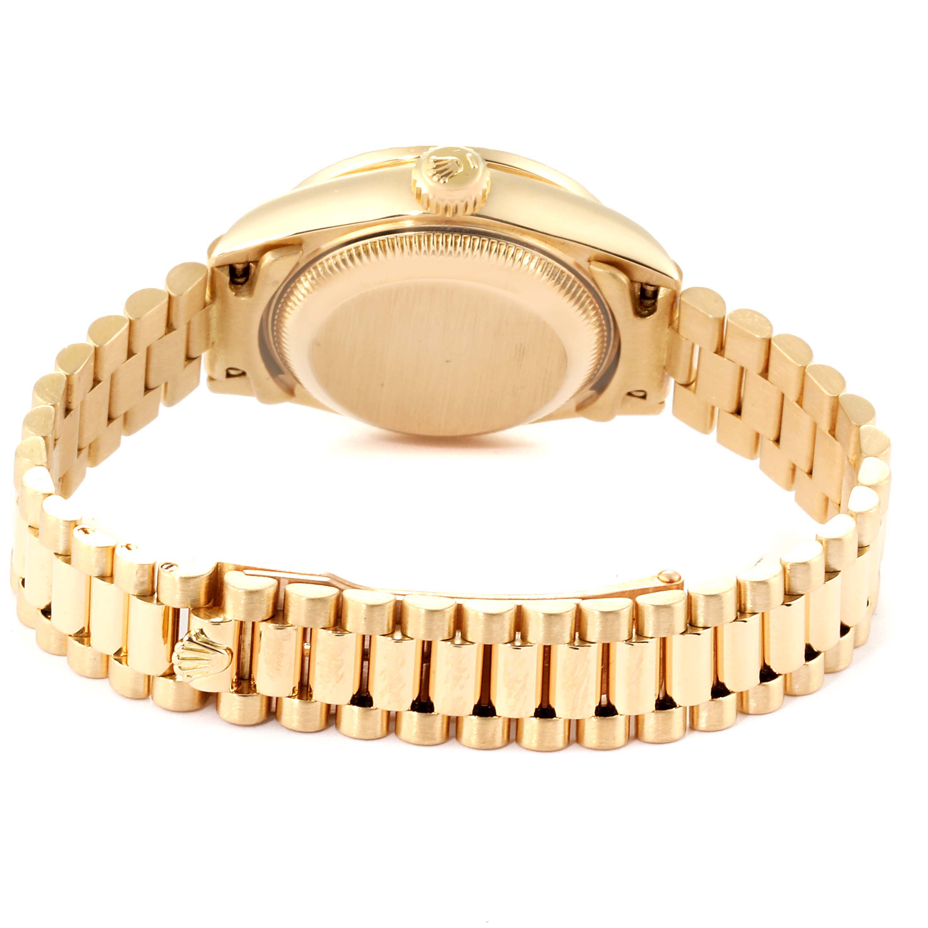 The image shows the back of a Rolex President 69138 Women
s Yellow Gold Champagne Dial 69138 Women
s Yellow Gold Champagne Dial model watch, focusing on the case back and gold bracelet with clasp.