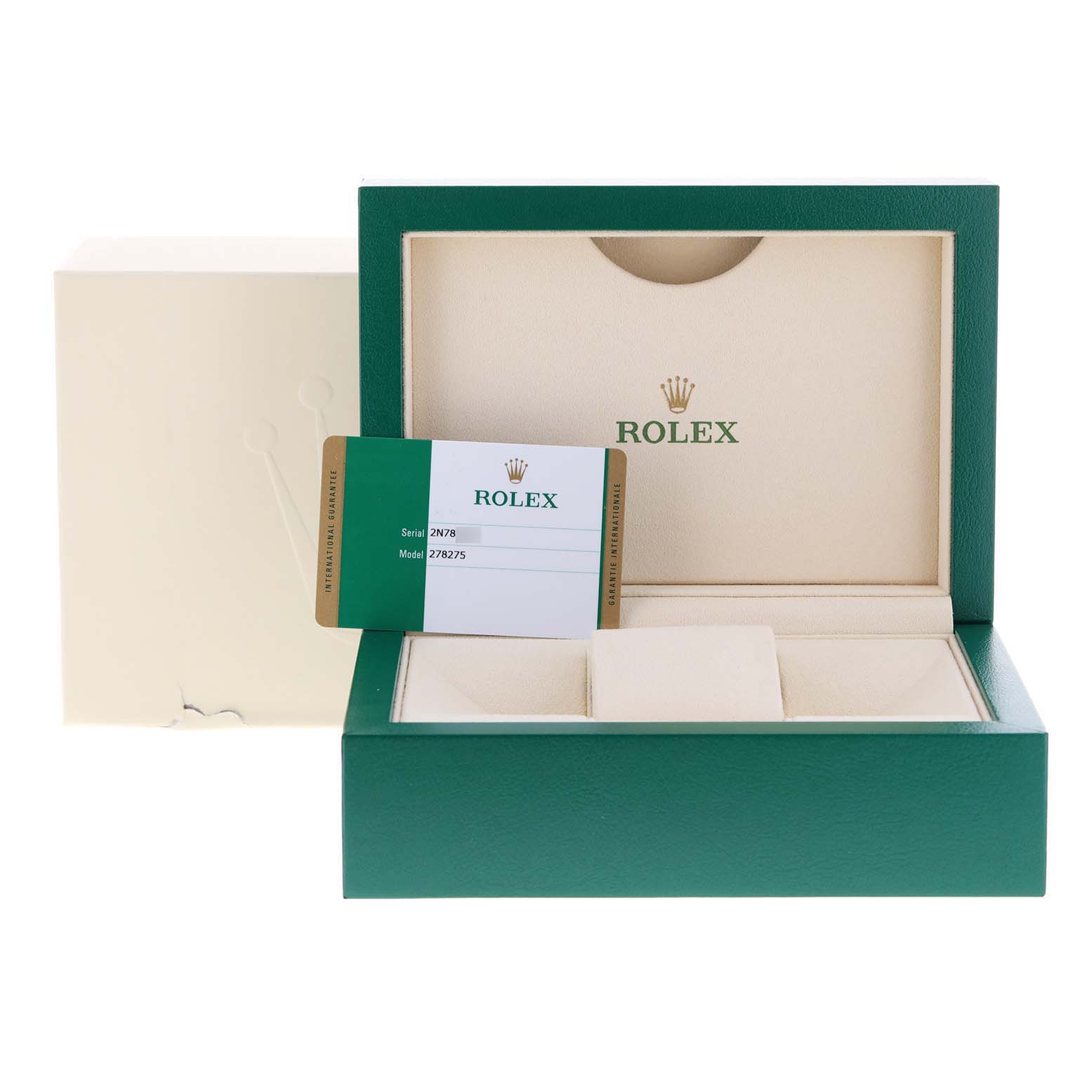 The image shows an open Rolex watch box with a card indicating the President model, viewed from the front.