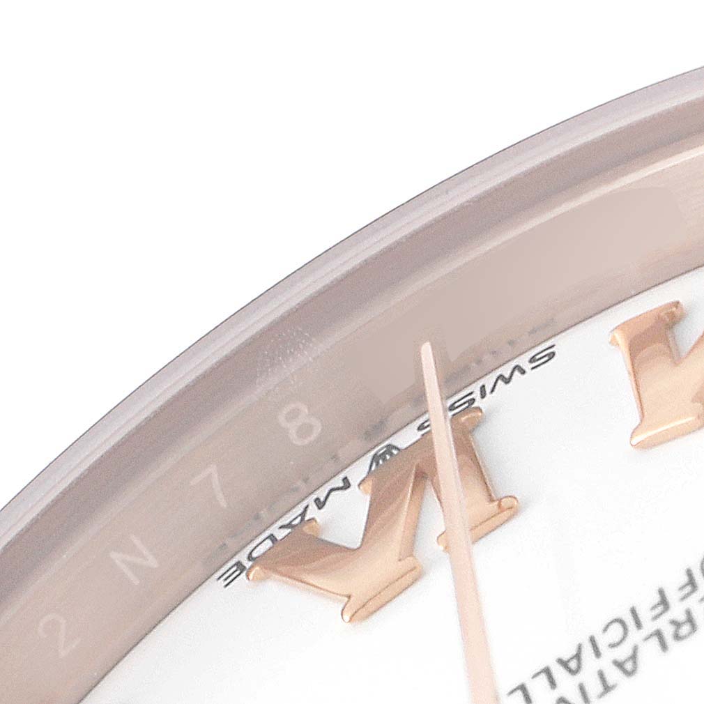 This close-up image of the Rolex President 278275 Women's Rose Gold White Dial 278275 Women's Rose Gold White Dial model watch shows a partial view of the dial and bezel with Roman numeral markers.