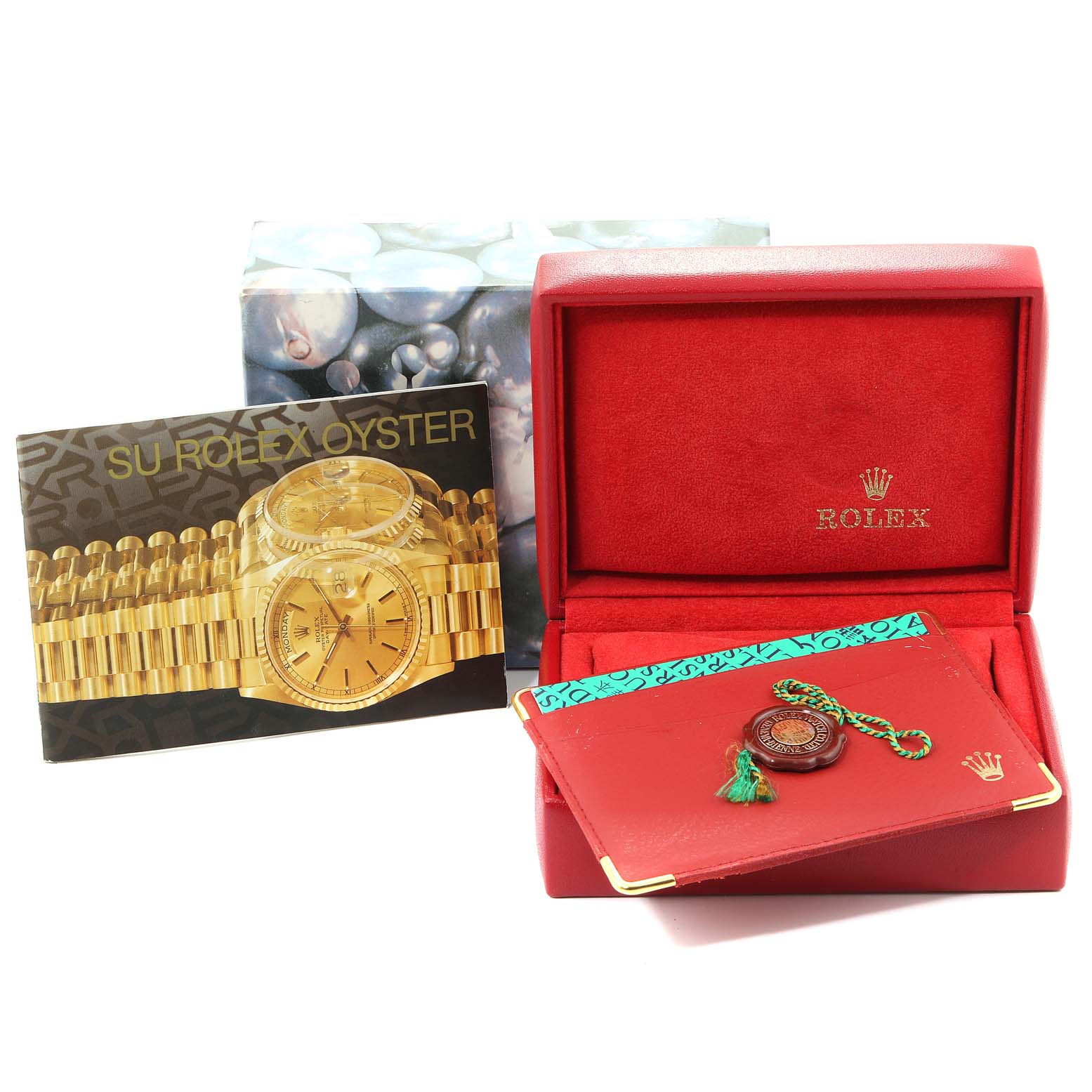 This image shows the accessories for a Rolex President 68279 Women's White Gold Silver Dial 68279 Women's White Gold Silver Dial model, including a box, booklet, and certification card, viewed from the front.