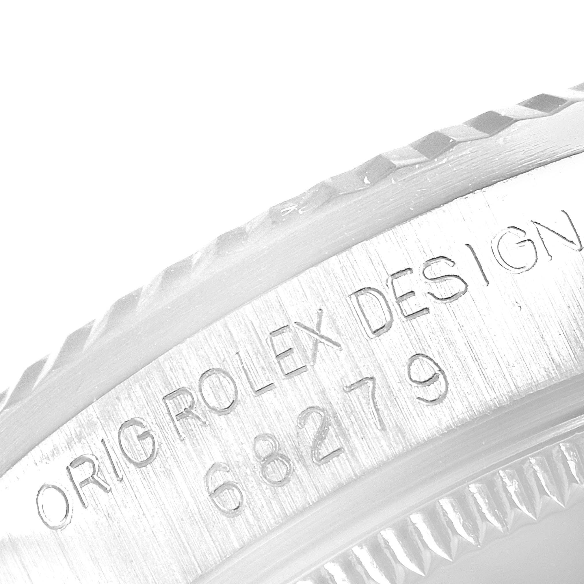 This image shows the serial number engraving on the side of the bezel of a Rolex President 68279 Women's White Gold Silver Dial 68279 Women's White Gold Silver Dial model watch.