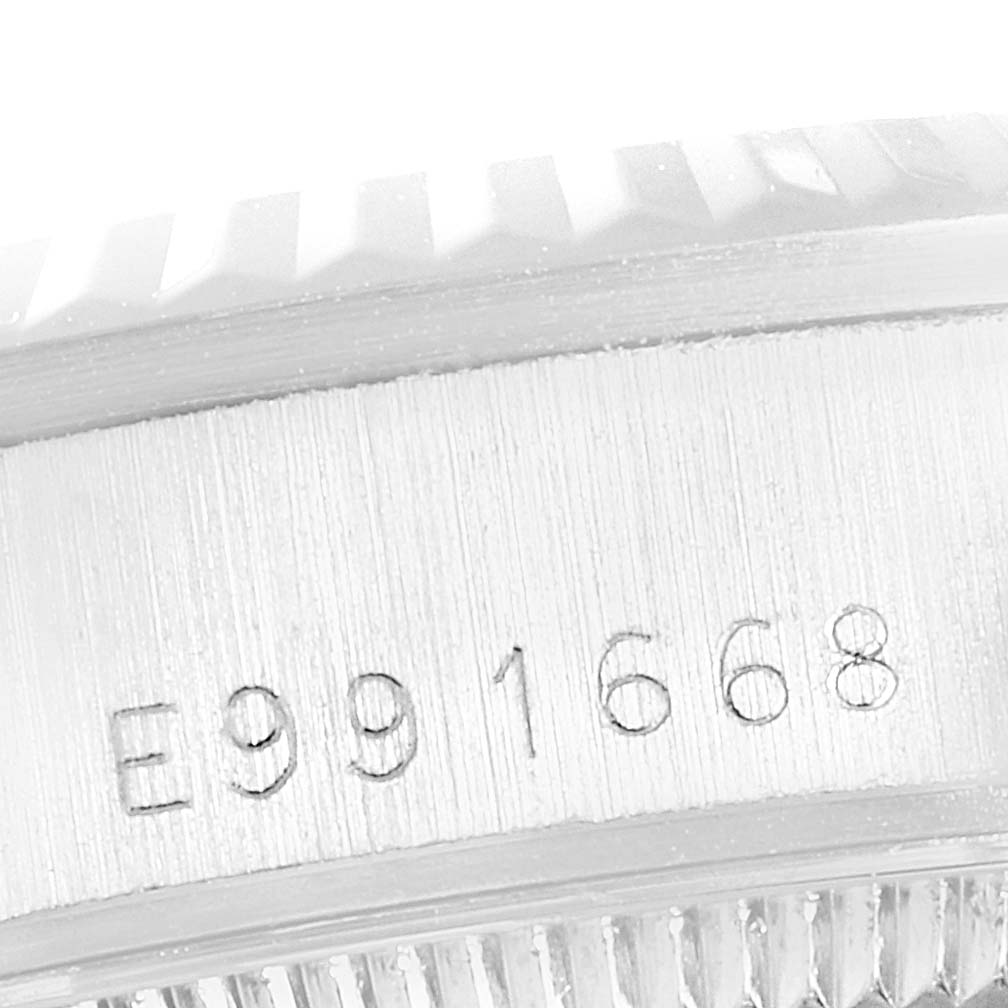 This close-up image shows the serial number engraving on the case side of the Rolex President 68279 Women's White Gold Silver Dial 68279 Women's White Gold Silver Dial model watch.