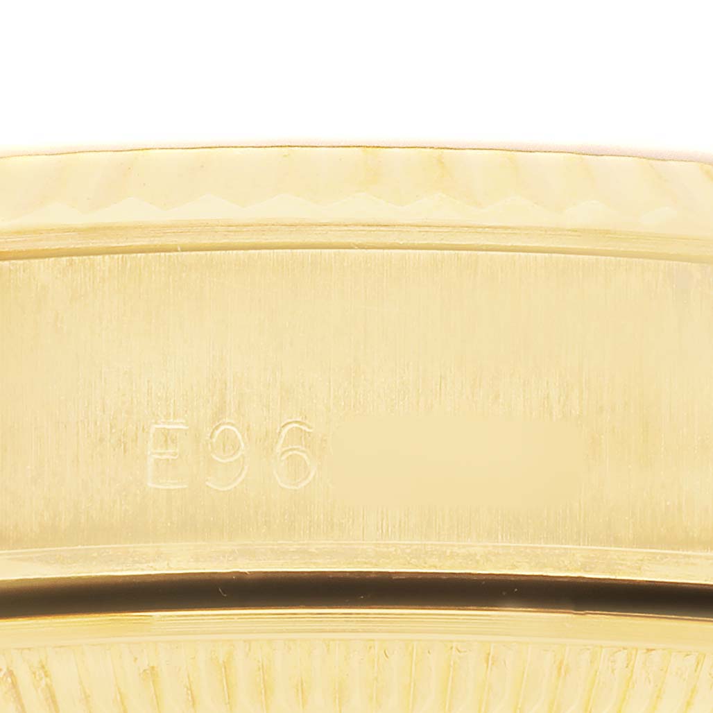 The image shows a close-up of the side of a Rolex President 69178 Women's Yellow Gold Champagne Dial model watch, highlighting brushed gold and engraving details.