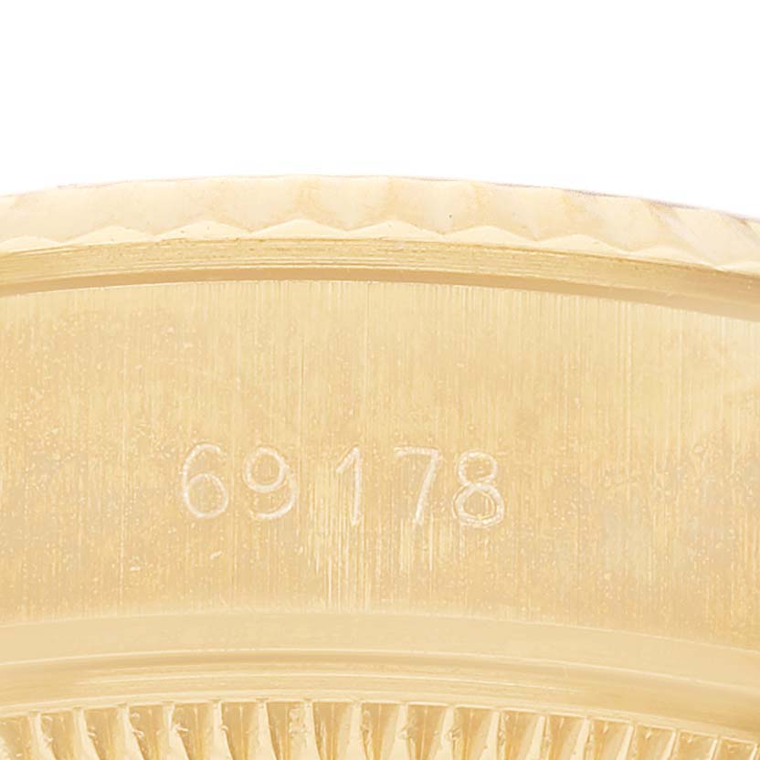 The image shows a close-up of the Rolex President 69178 Women's Yellow Gold Champagne Dial model's side, highlighting the case details and reference number.