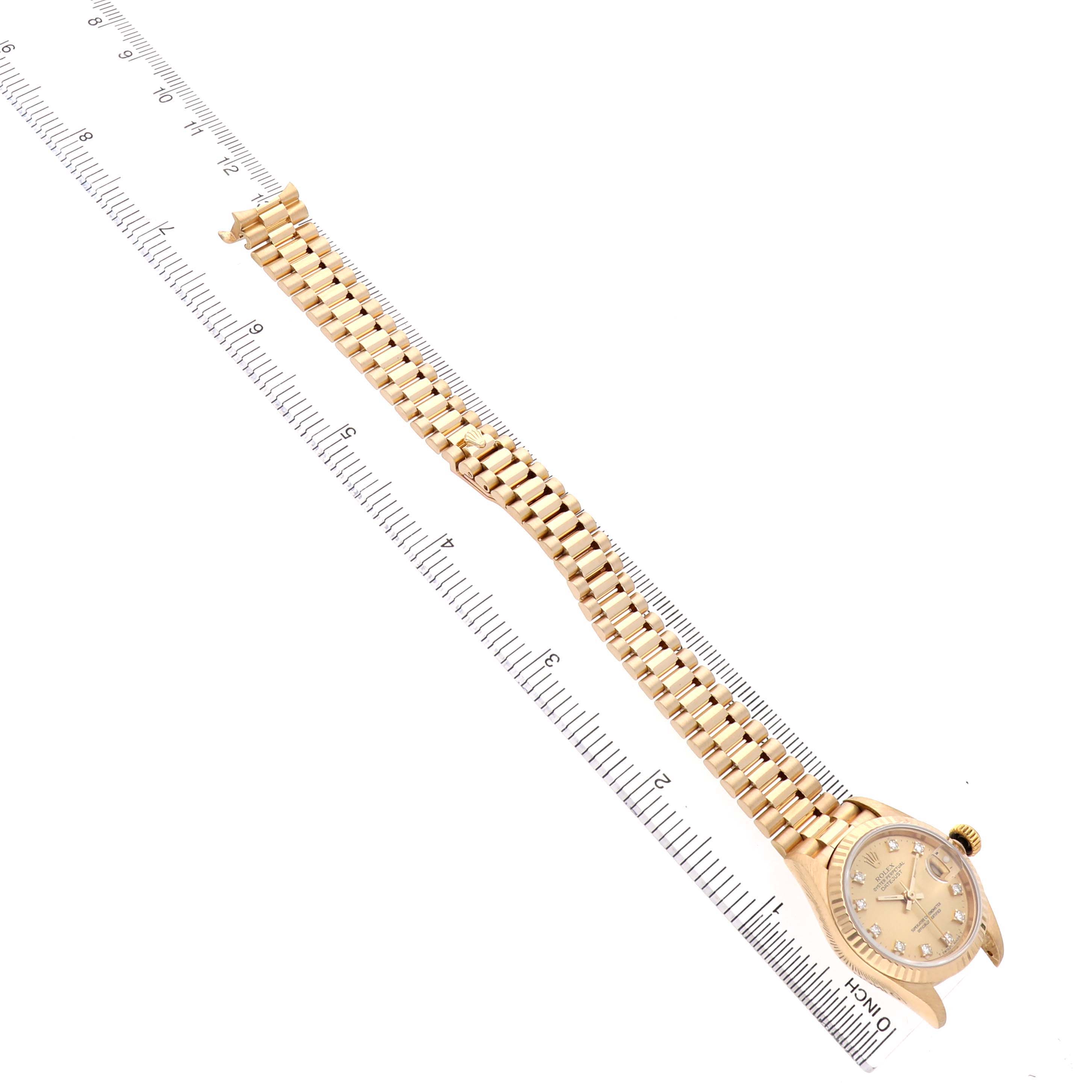 The Rolex Datejust 69178 Women's Yellow Gold Champagne Dial watch is shown at a diagonal angle, highlighting the gold bracelet and the face with diamond hour markers.