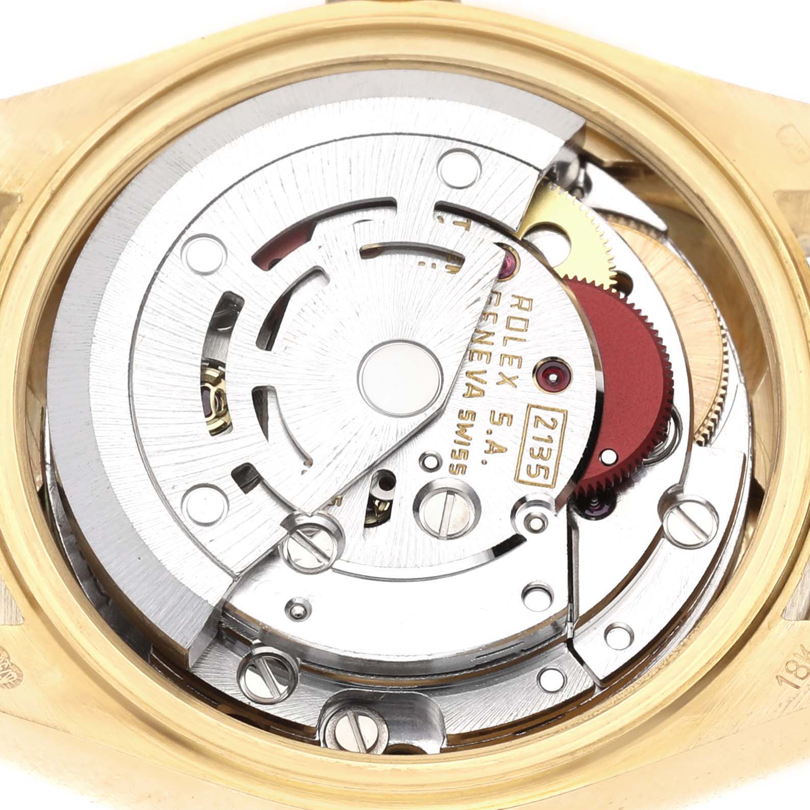The image shows the movement of a Rolex Datejust 69178 Women's Yellow Gold Champagne Dial watch, highlighting gears and rotor from a top-down angle.