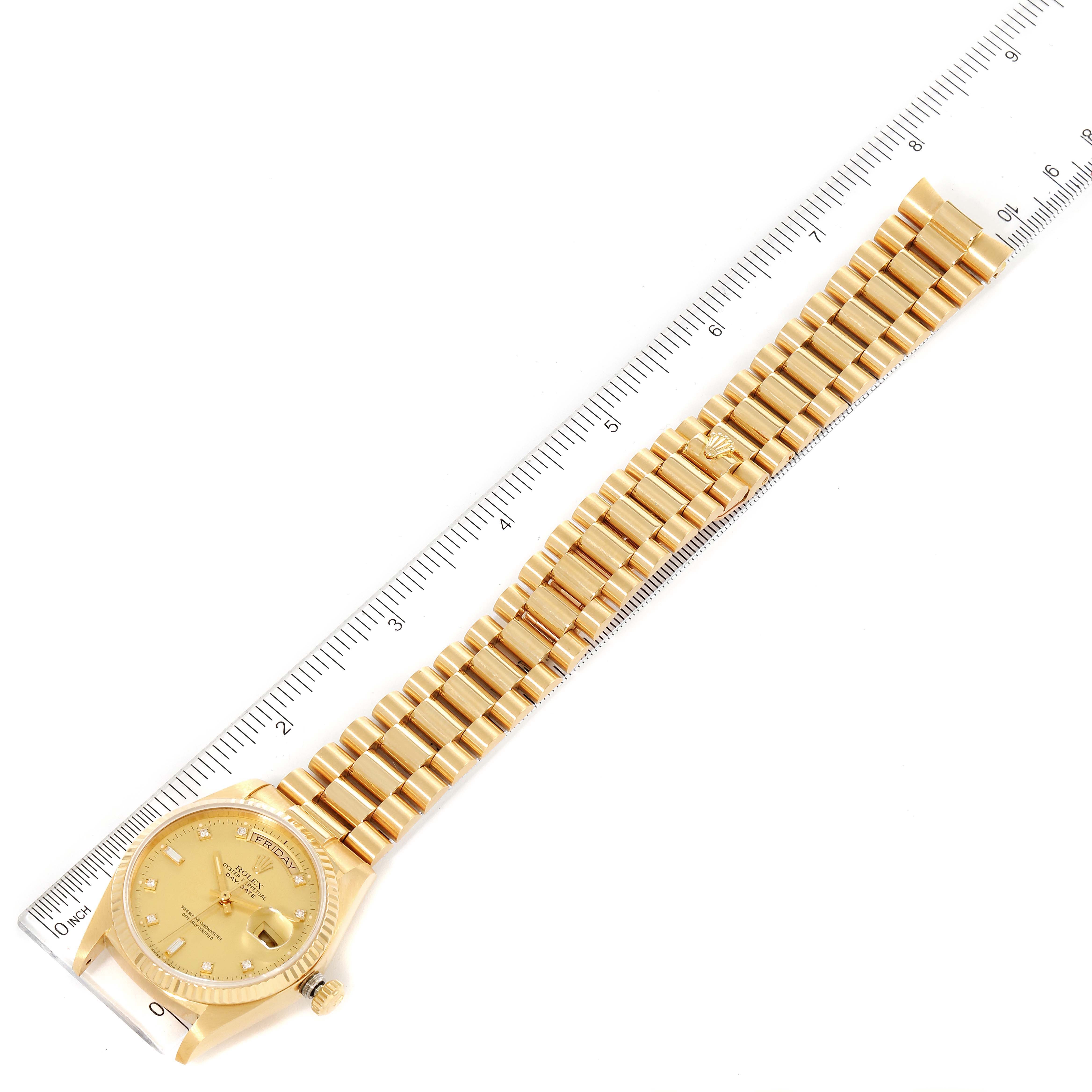 The image shows a top-down view of a gold Rolex President 18038 Men's Yellow Gold Champagne Dial 18038 Men's Yellow Gold Champagne Dial model watch with a ruler beside it for scale.