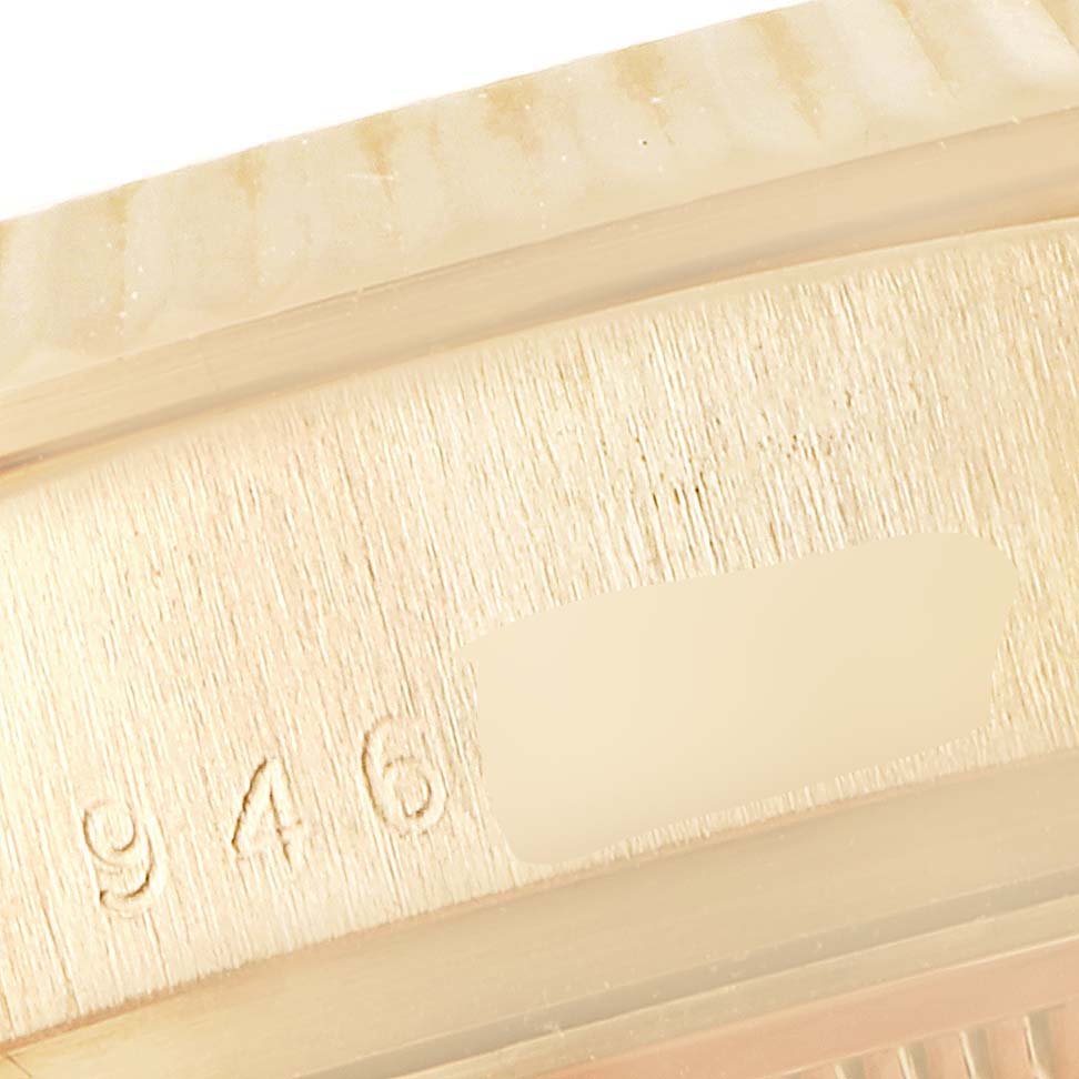 This image shows a close-up of the identifying marks on the side of a Rolex President 18038 Men's Yellow Gold Champagne Dial 18038 Men's Yellow Gold Champagne Dial model watch case.