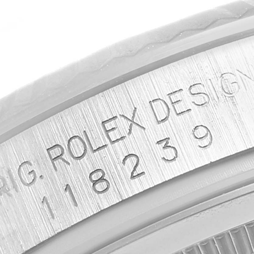The image shows a close-up view of the side engraving on a Rolex President 118239 Men's White Gold Silver Dial 118239 Men's White Gold Silver Dial model watch.