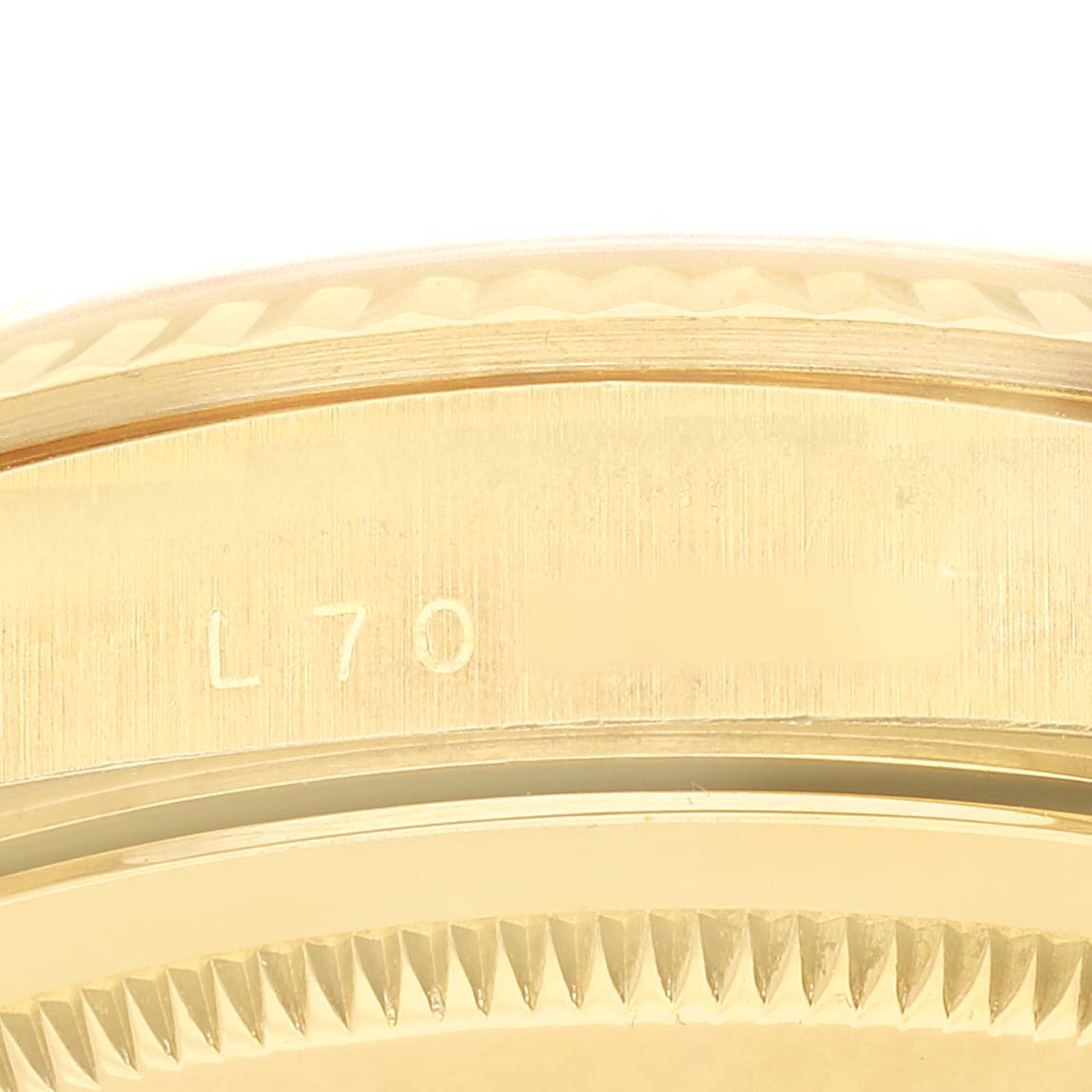The image shows a close-up side view of the edge and engraving on the bezel of a Rolex President 18238 Men's Yellow Gold Champagne Dial model.