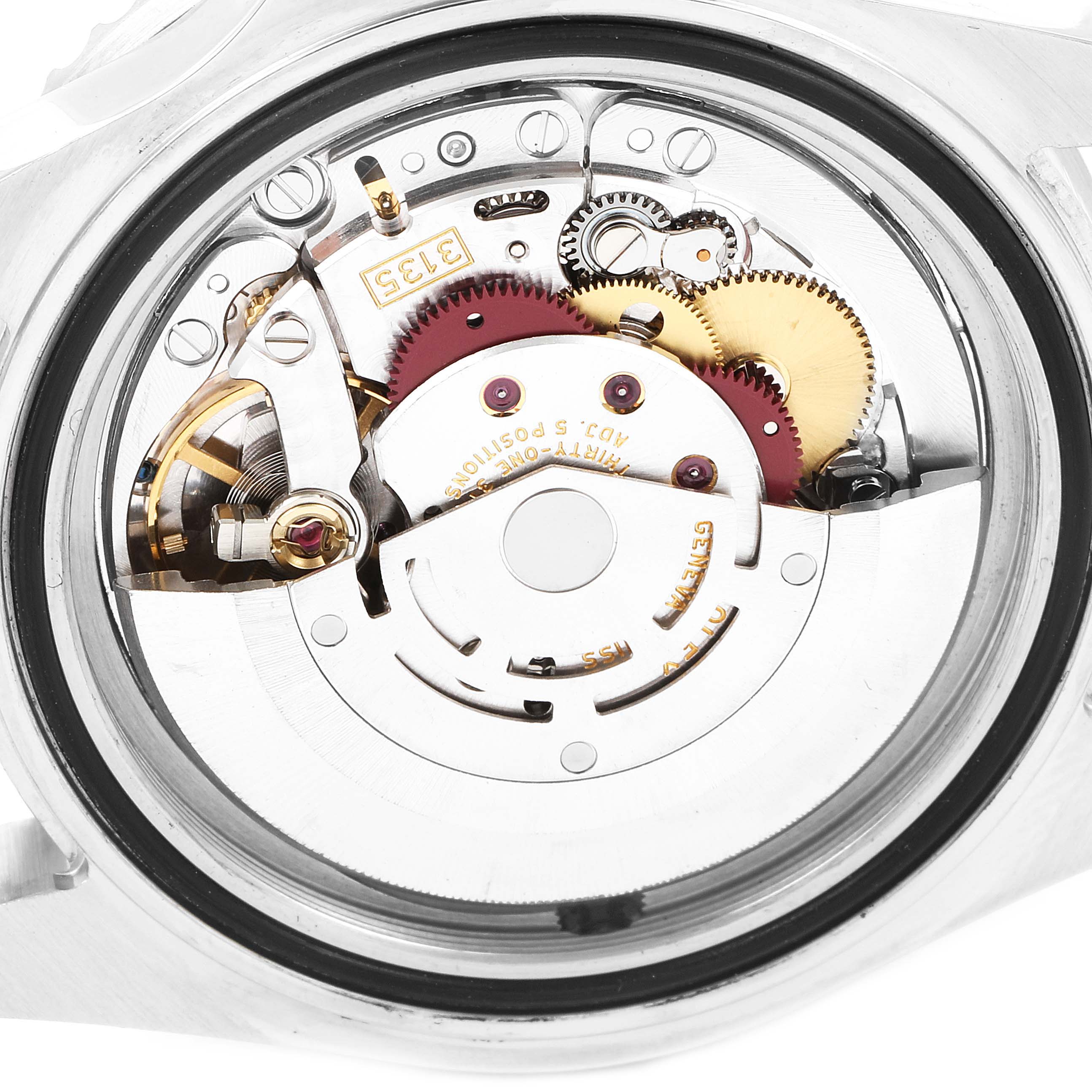 The image shows a close-up view of the movement mechanism inside the Rolex Sea-Dweller 16600 Men
s Stainless Steel Black Dial 16600 Men
s Stainless Steel Black Dial watch, highlighting the gears and other internal components.