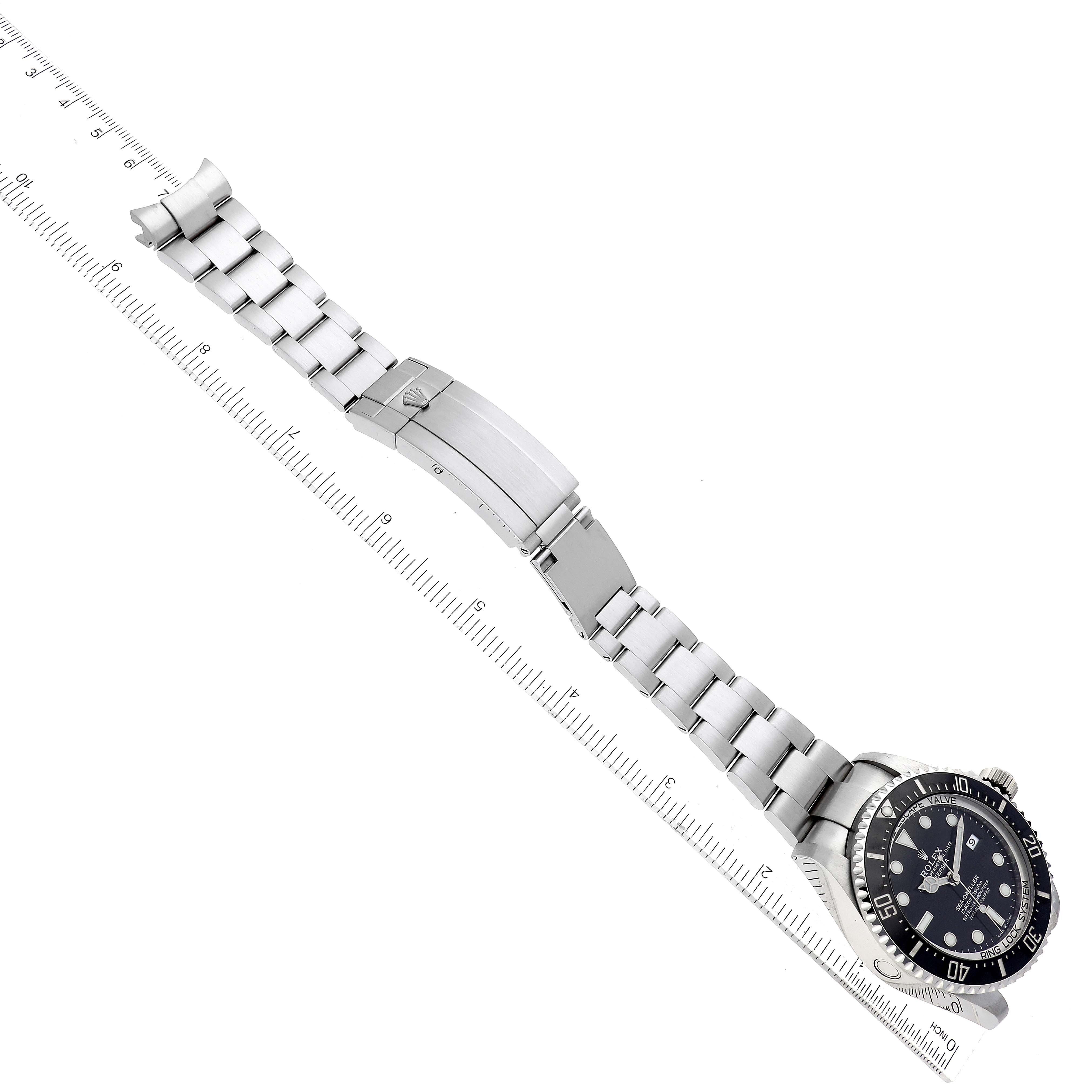 The image shows the Rolex Sea-Dweller 126660 Men
s Stainless Steel Black Dial 126660 Men
s Stainless Steel Black Dial watch laid flat from an overhead angle, displaying the full bracelet and clasp.