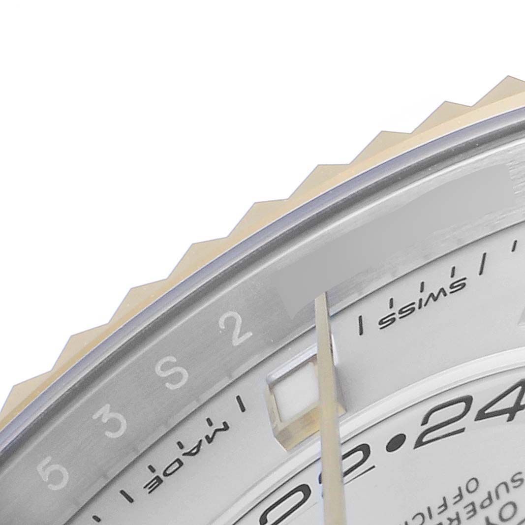The image shows a close-up of the Rolex Sky-Dweller 326933 Men's Steel and Gold (two tone) White Dial 326933 Men's Steel and Gold (two tone) White Dial watch dial and a portion of the fluted bezel.