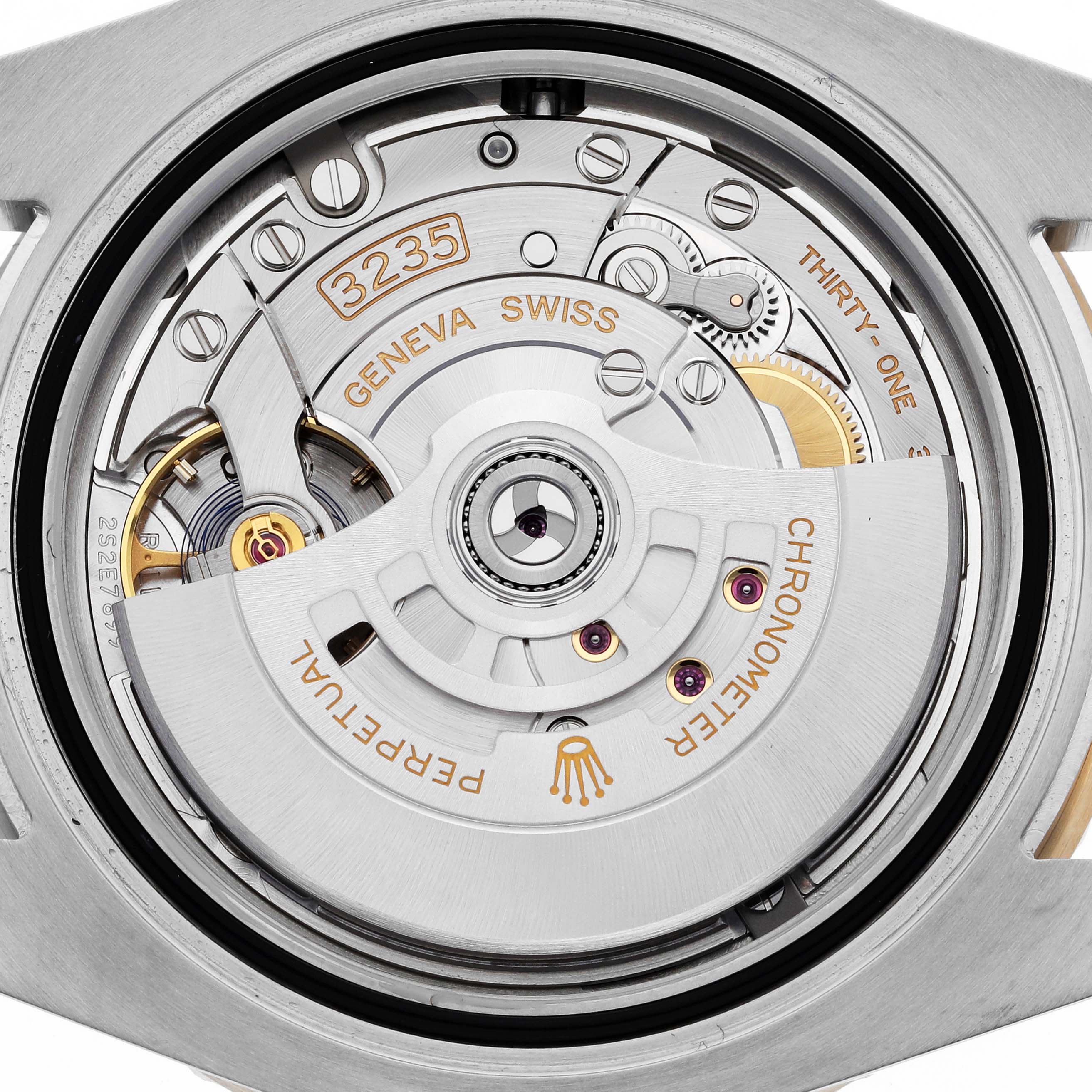 The image shows the movement mechanism of a Rolex Submariner 126613 Men's Steel and Gold (two tone) Blue Dial 126613 Men's Steel and Gold (two tone) Blue Dial watch, highlighting its intricate Geneva Swiss 3235 components.