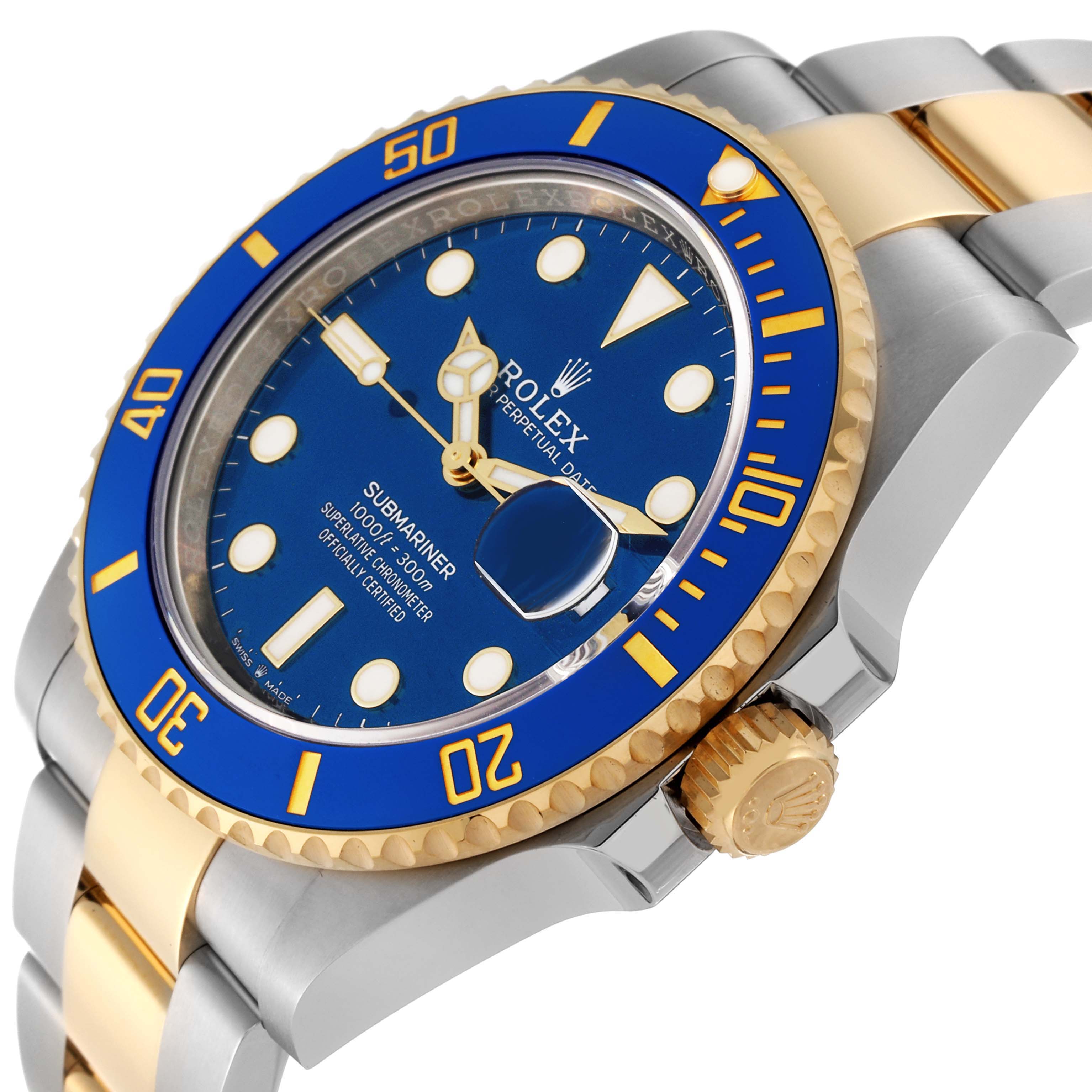 The image shows a close-up of the Rolex Submariner 126613 Men's Steel and Gold (two tone) Blue Dial 126613 Men's Steel and Gold (two tone) Blue Dial watch displaying its blue bezel, blue dial, gold crown, and oyster bracelet.