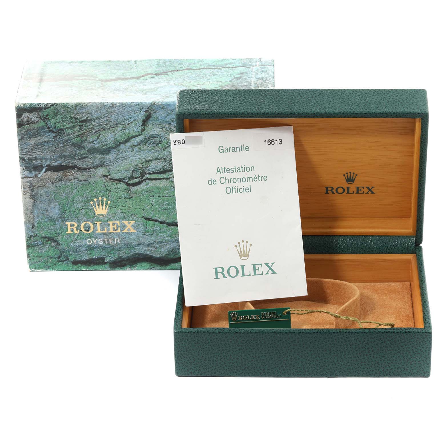 The image shows an open Rolex Submariner 16613 Men's Steel and Gold (two tone) Blue Dial 16613 Men's Steel and Gold (two tone) Blue Dial watch box with a green exterior, beige interior, and accompanying warranty card.