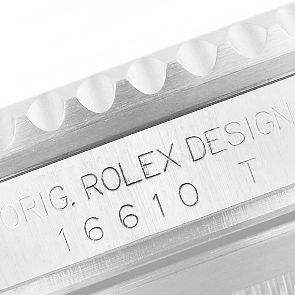 The image shows a close-up view of the model number and engravings on the side of a Rolex Submariner 16610LV Men
s Stainless Steel Black Dial 16610LV Men
s Stainless Steel Black Dial watch case.