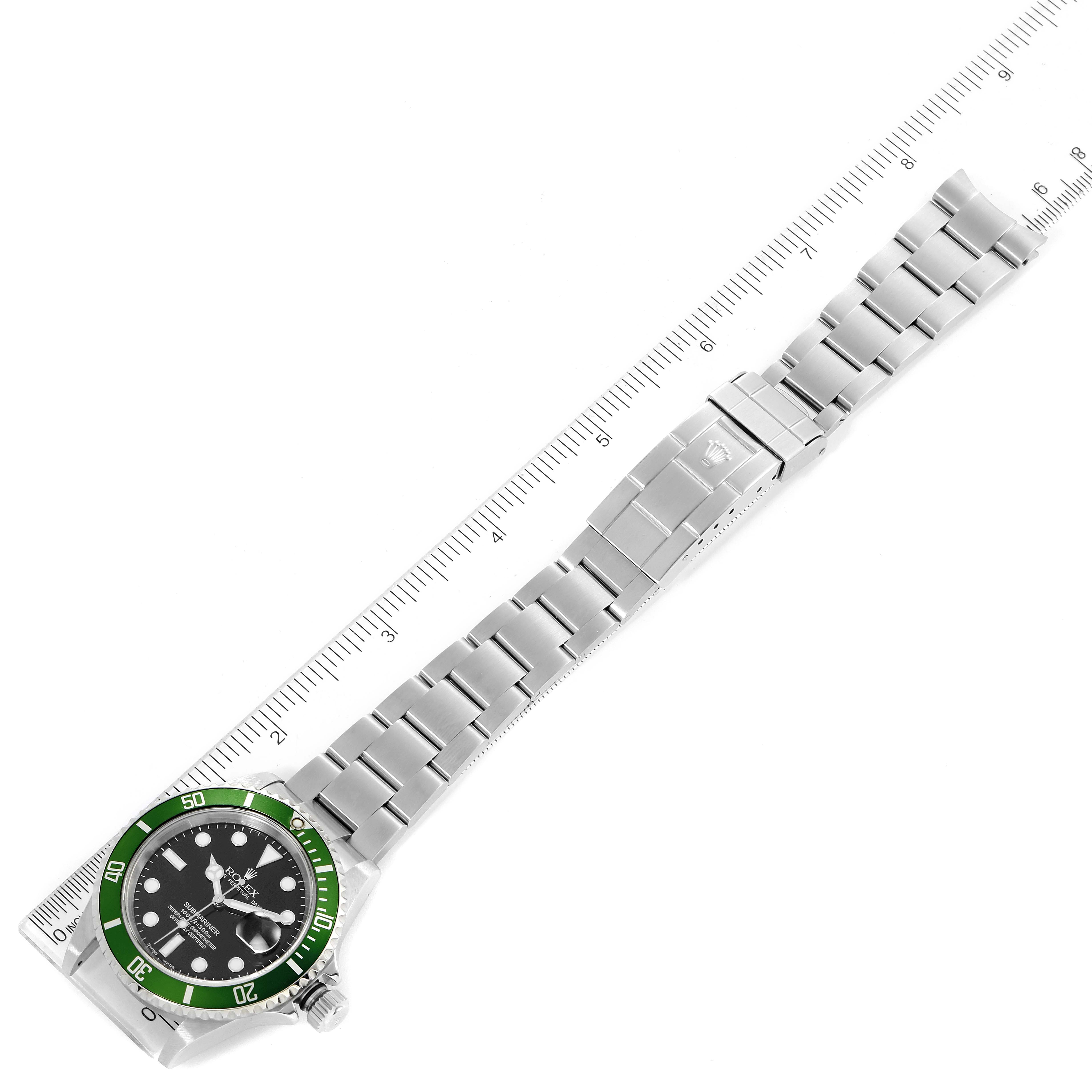 The image shows a top-down view of a Rolex Submariner 16610LV Men
s Stainless Steel Black Dial 16610LV Men
s Stainless Steel Black Dial watch, highlighting the face, bezel, and bracelet with a ruler next to it.