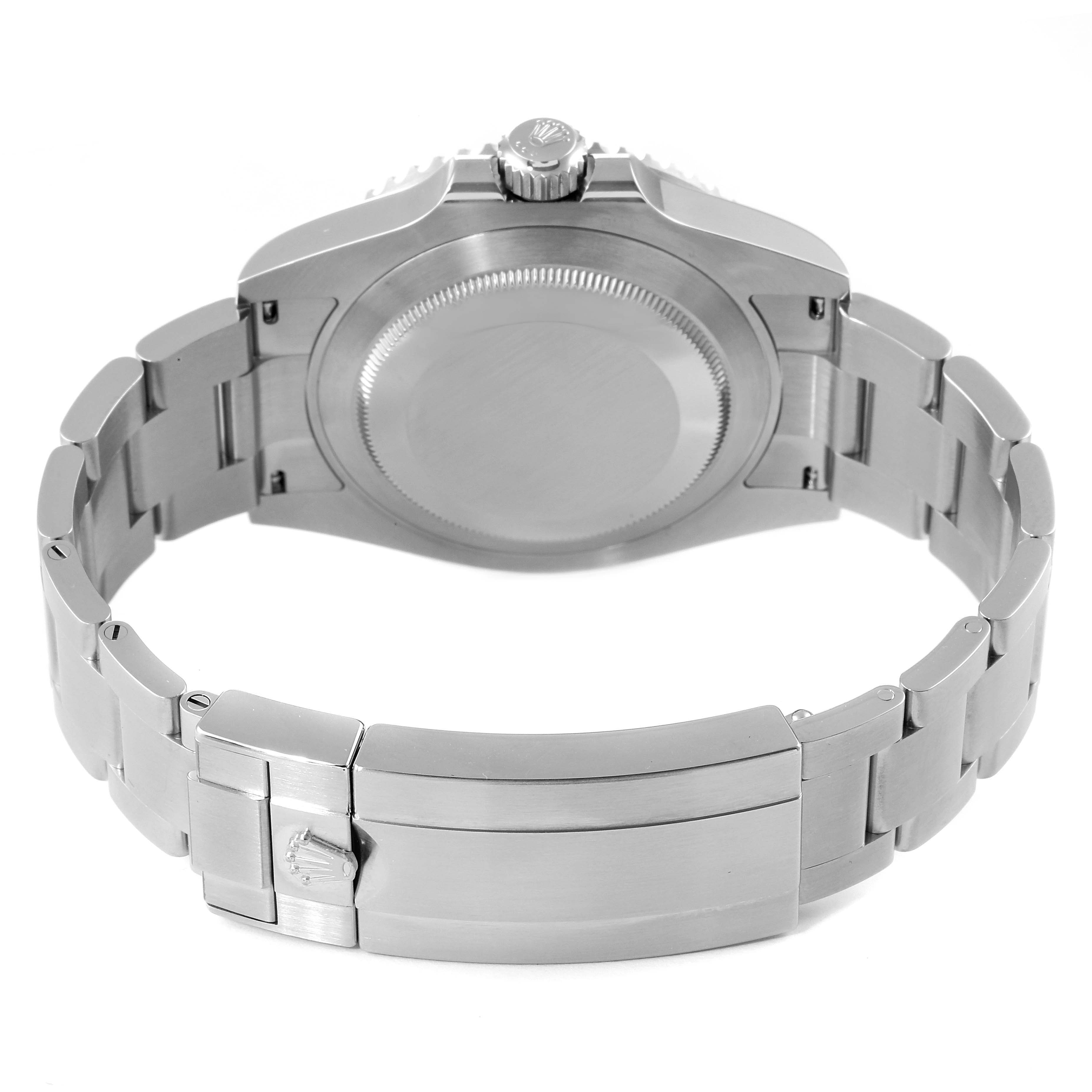 The image shows the back view of a Rolex Submariner 126610LV Men
s Stainless Steel Black Dial 126610LV Men
s Stainless Steel Black Dial watch, highlighting its case, crown, and metal bracelet.