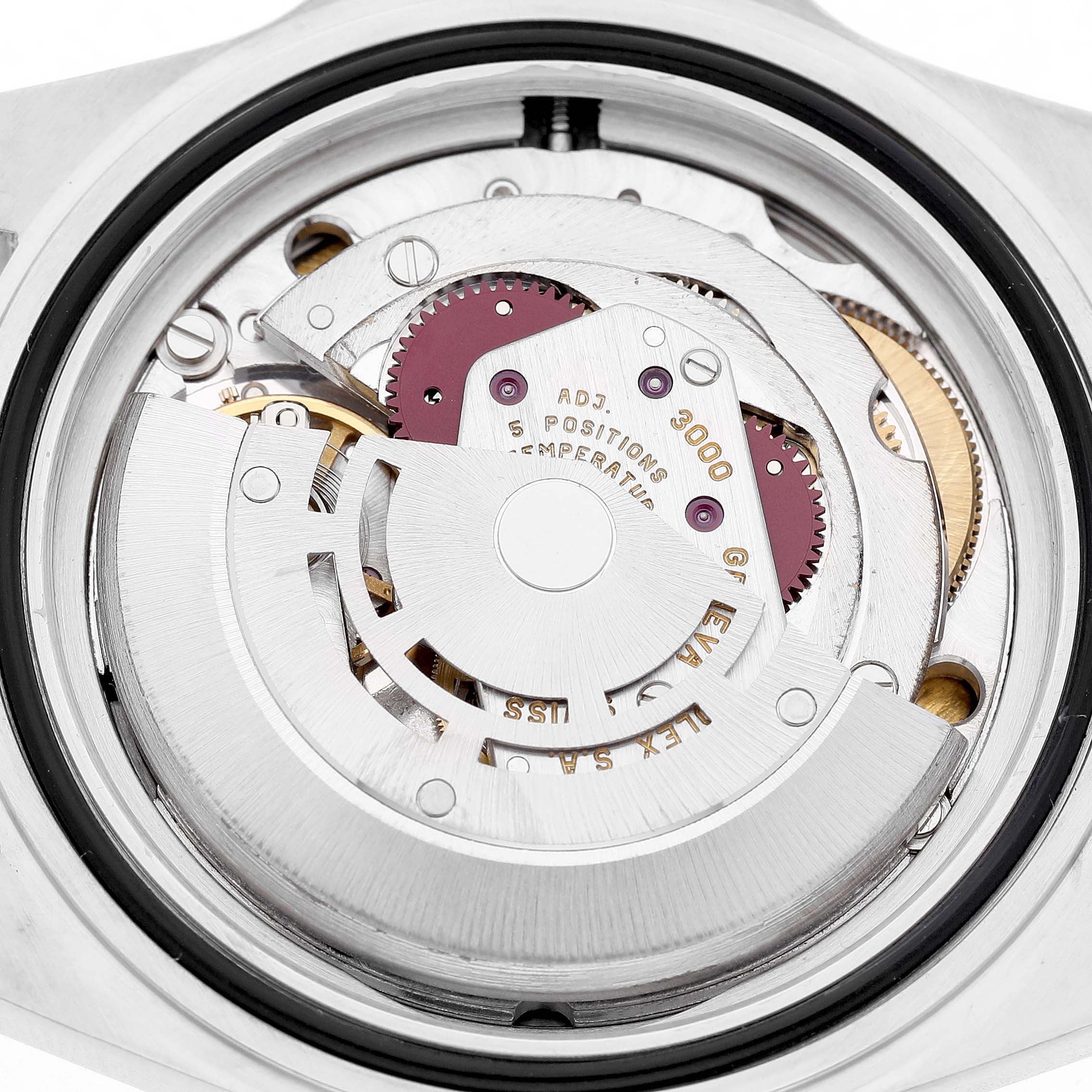 The image shows the movement of a Rolex Submariner 14060M Men's Stainless Steel Black Dial watch from a top-down angle, highlighting gears and the rotor.