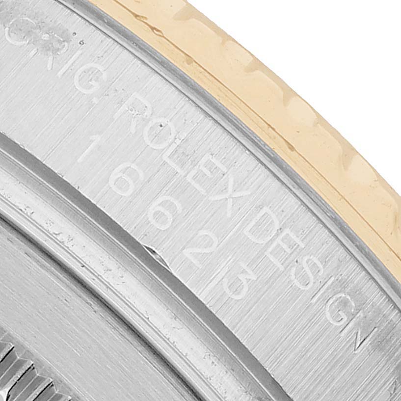The image shows a close-up of the case side and bezel edge of a Rolex Yacht-Master 16623 Men's Steel and Gold (two tone) Grey Dial watch, highlighting the engraved branding details.
