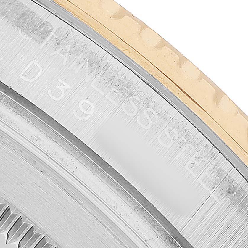 The image shows a close-up of the bezel and case edge for a Rolex Yacht-Master 16623 Men's Steel and Gold (two tone) Grey Dial watch, highlighting the materials and markings.