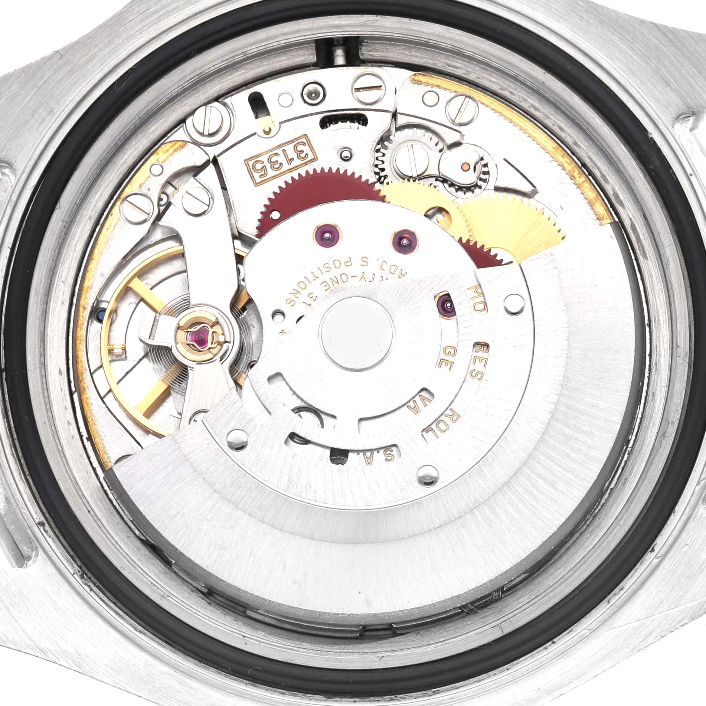 The image shows the movement of a Rolex Yacht-Master 16622 Men
s Stainless Steel Silver Dial 16622 Men
s Stainless Steel Silver Dial watch viewed from the back, displaying gears and components.