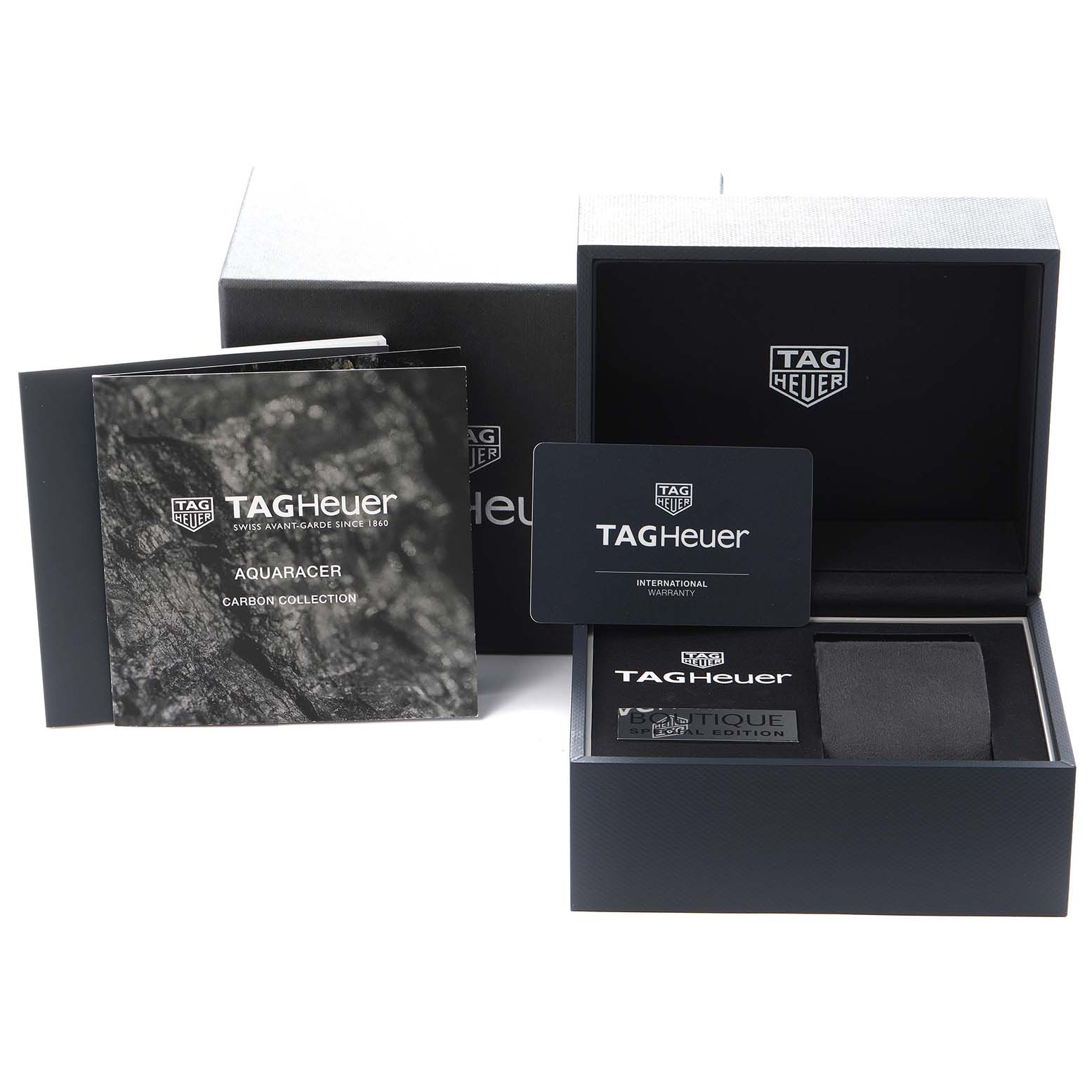 The image shows Tag Heuer Aquaracer WBD218B.FC6446 Men
s Titanium Black Dial WBD218B.FC6446 Men
s Titanium Black Dial packaging, manuals, a warranty card, and an open box from a front angle.