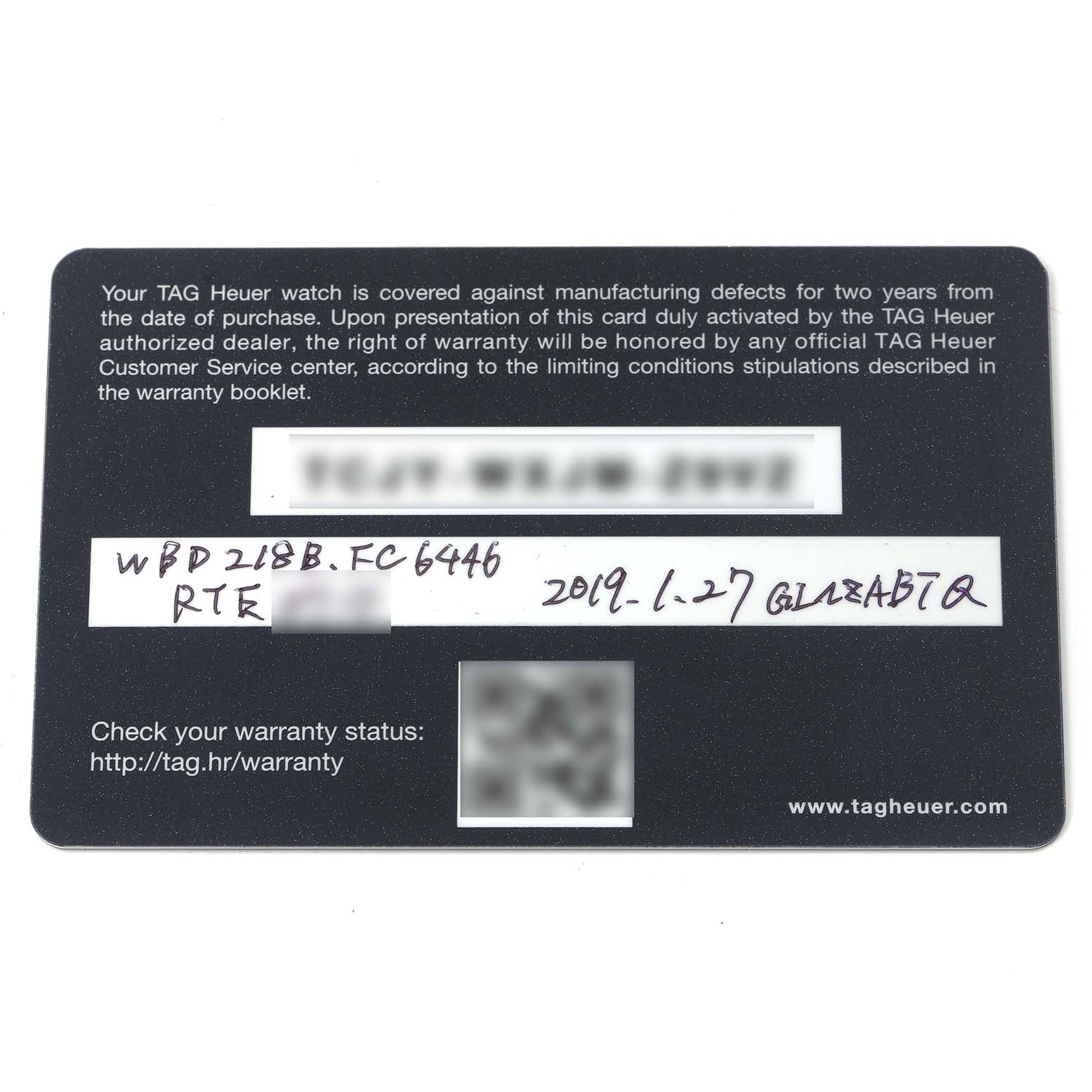 This image shows a Tag Heuer Aquaracer WBD218B.FC6446 Men
s Titanium Black Dial WBD218B.FC6446 Men
s Titanium Black Dial warranty card from a top view.