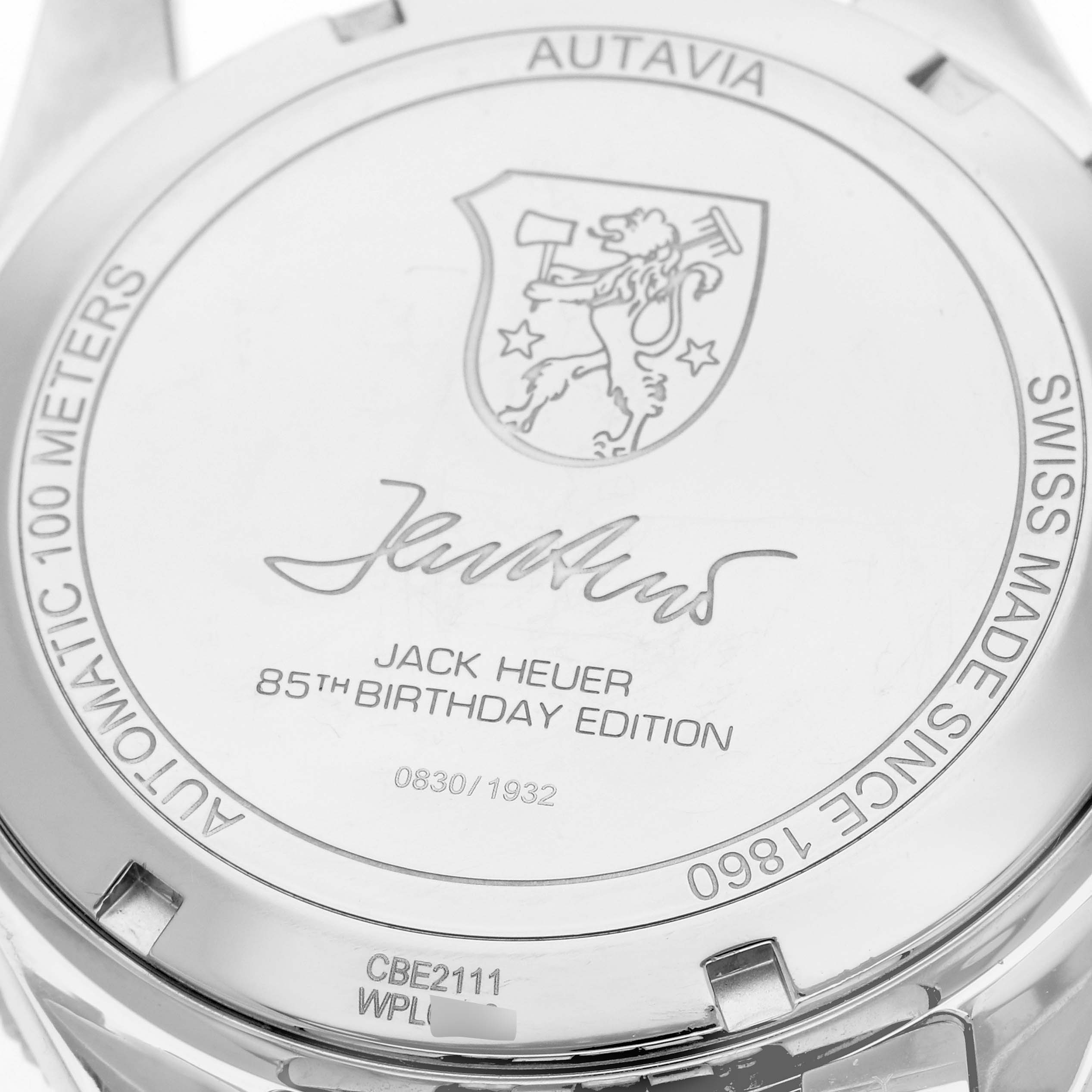 The image shows the back case of a Tag Heuer Autavia CBE2111.BA0687 Men
s Stainless Steel Silver Dial CBE2111.BA0687 Men
s Stainless Steel Silver Dial Limited Edition watch, featuring an engraving for Jack Heuer
s 85th Birthday Edition.