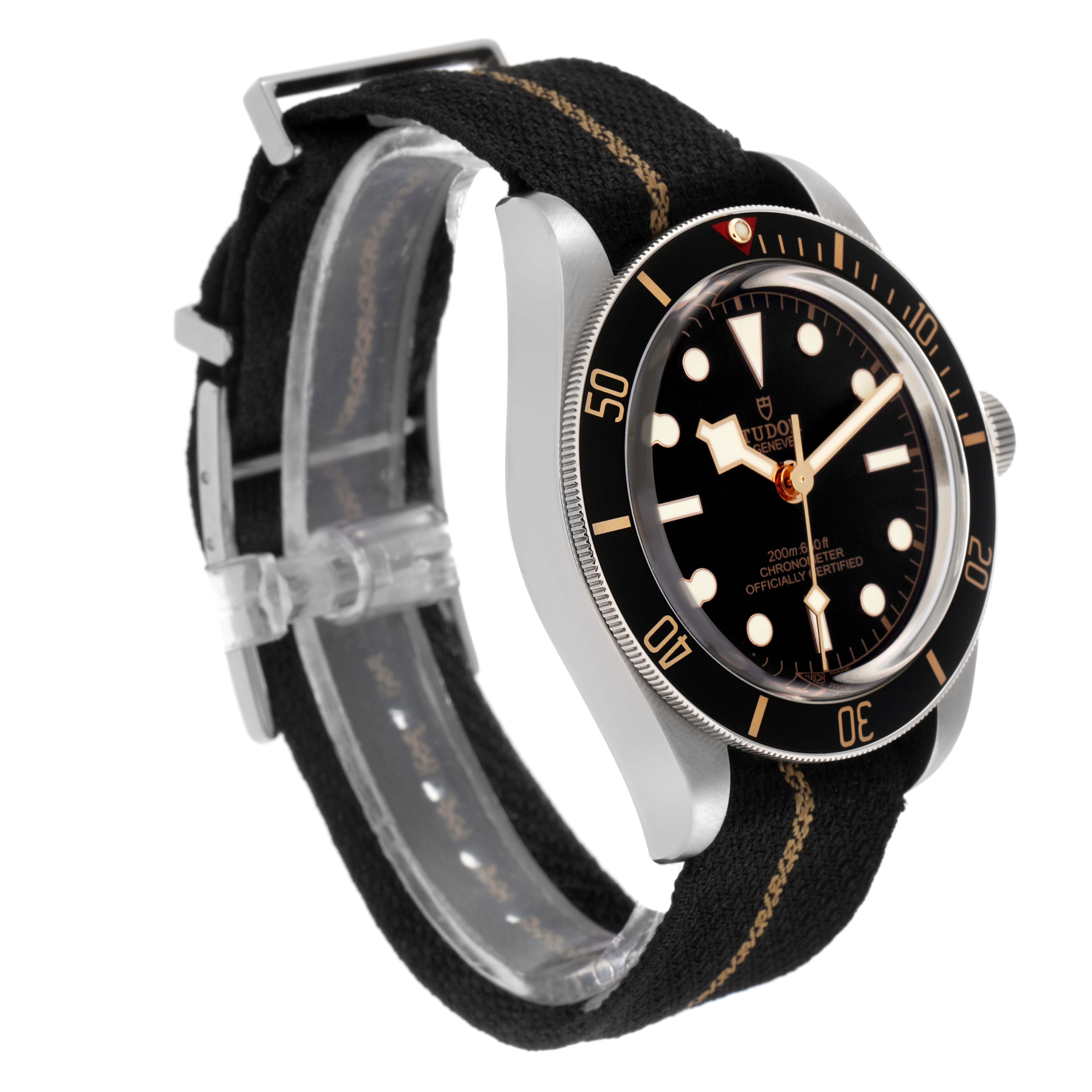 The Tudor Heritage Black Bay 79030 Men
s Stainless Steel Black Dial 79030 Men
s Stainless Steel Black Dial watch is shown from an angled side view, highlighting the face, bezel, case, and fabric strap.