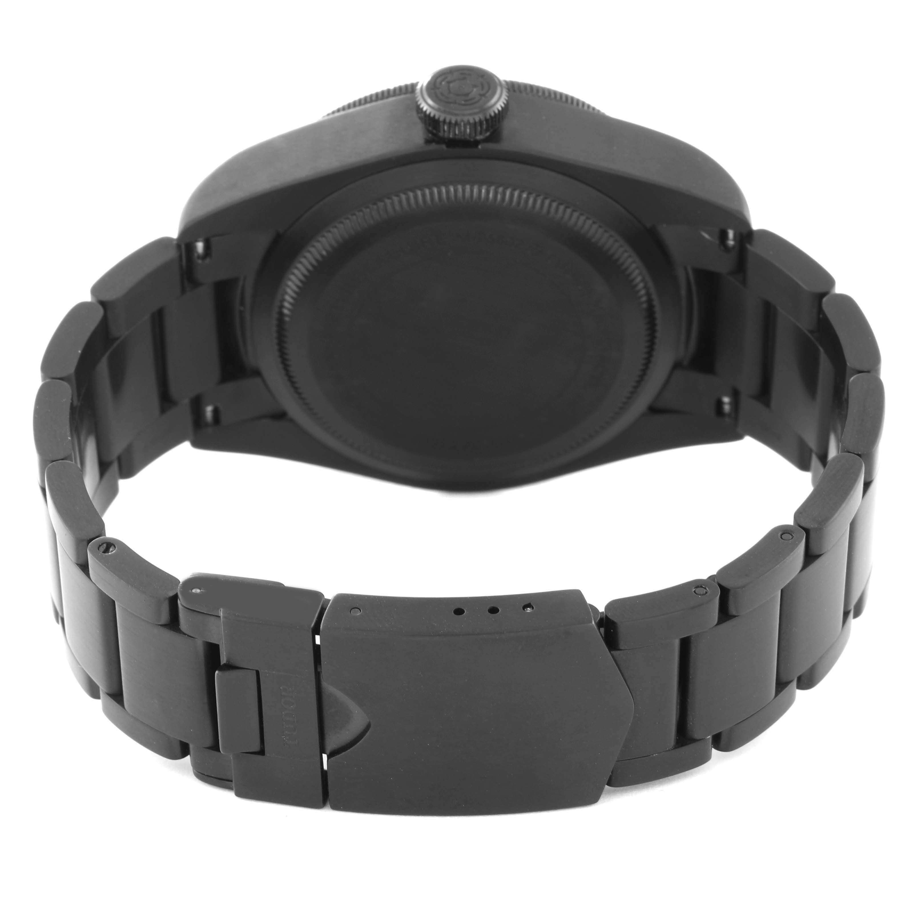 This image shows the back case, crown, and bracelet clasp of the Tudor Heritage Black Bay 79230DK Men's Stainless Steel Black Dial 79230DK Men's Stainless Steel Black Dial watch from a rear angle.