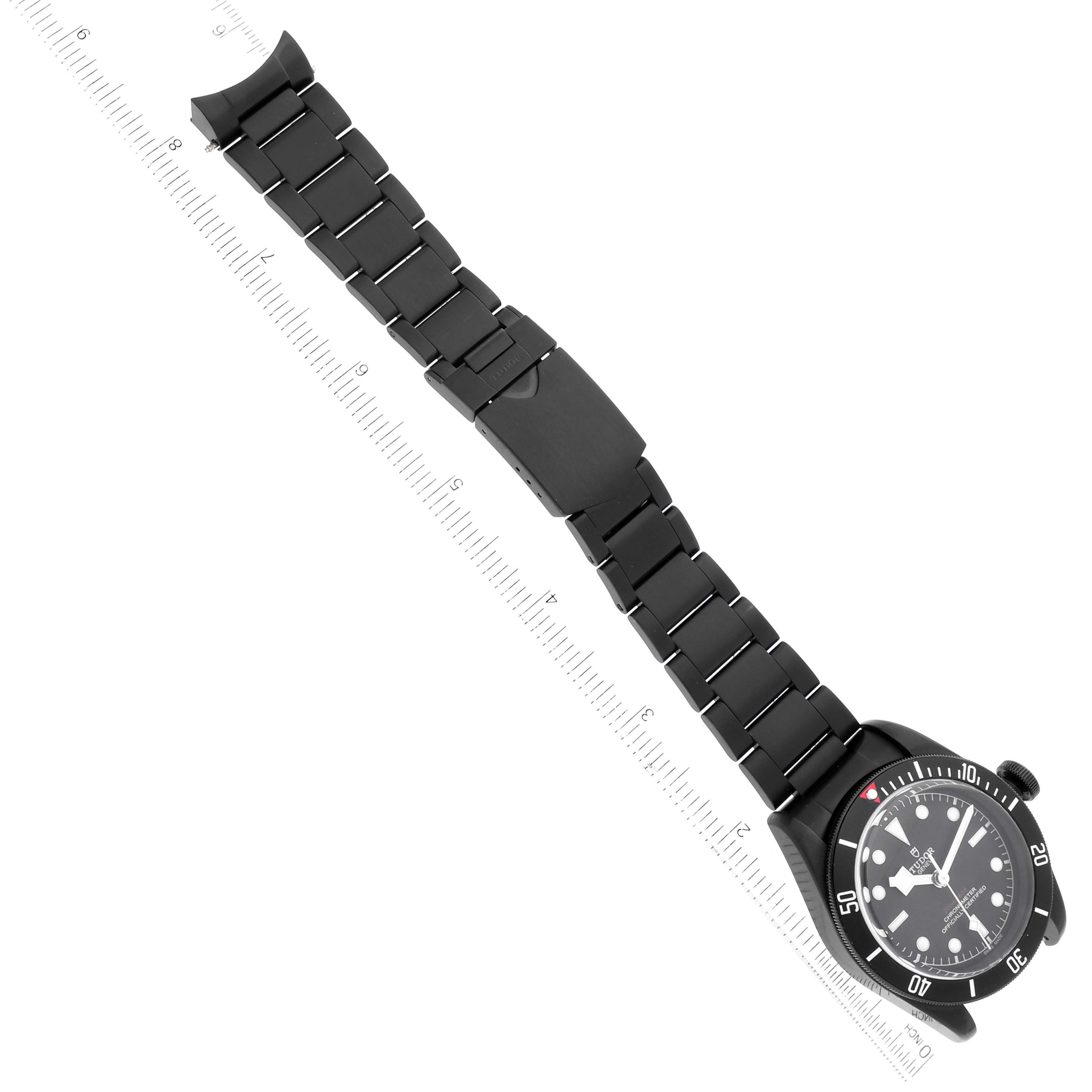 The image shows a Tudor Heritage Black Bay 79230DK Men's Stainless Steel Black Dial 79230DK Men's Stainless Steel Black Dial watch at a top-down angle, highlighting the dial and full bracelet.