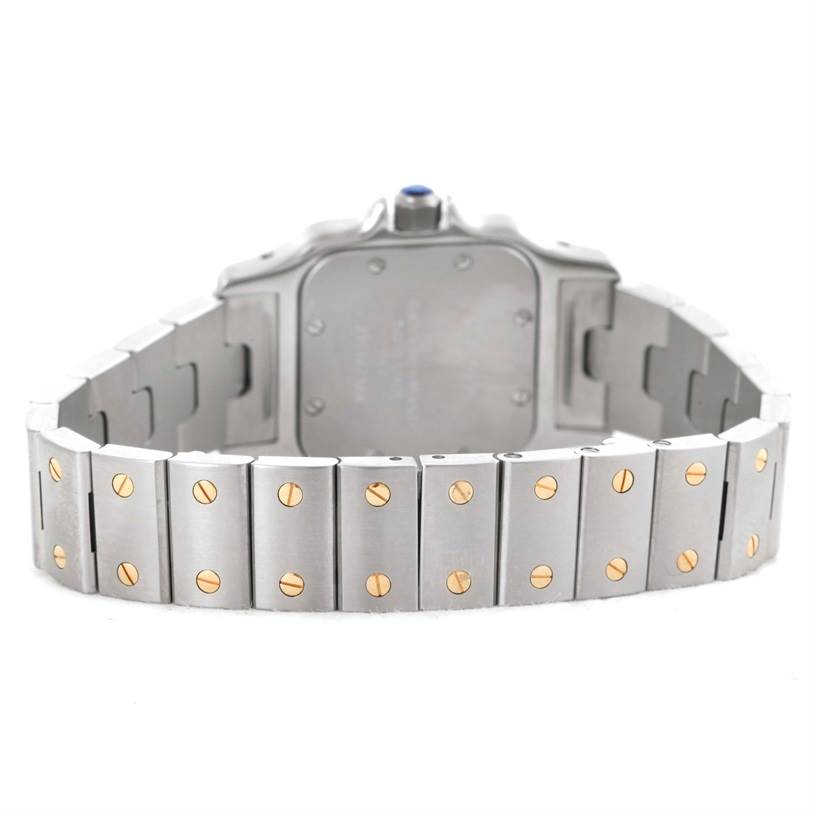 The image shows the backside and bracelet of a Cartier Santos W20012C4 Women
s Stainless Steel Silver Dial W20012C4 Women
s Stainless Steel Silver Dial watch, highlighting the metal links and screws.