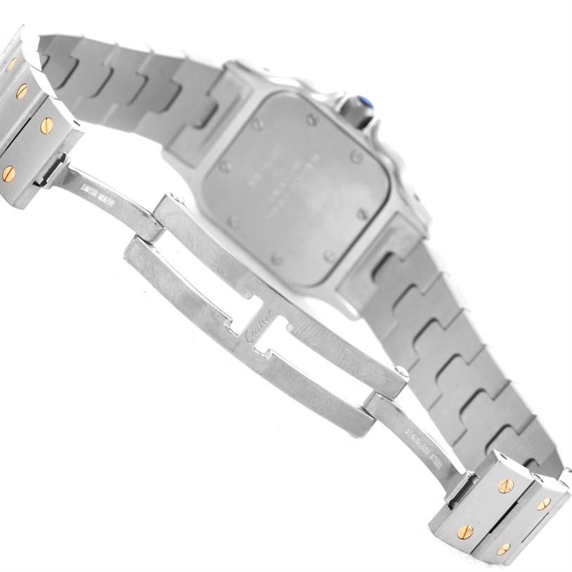 The image shows the backside and clasp of a Santos model by Cartier, highlighting the bracelet and deployment clasp.