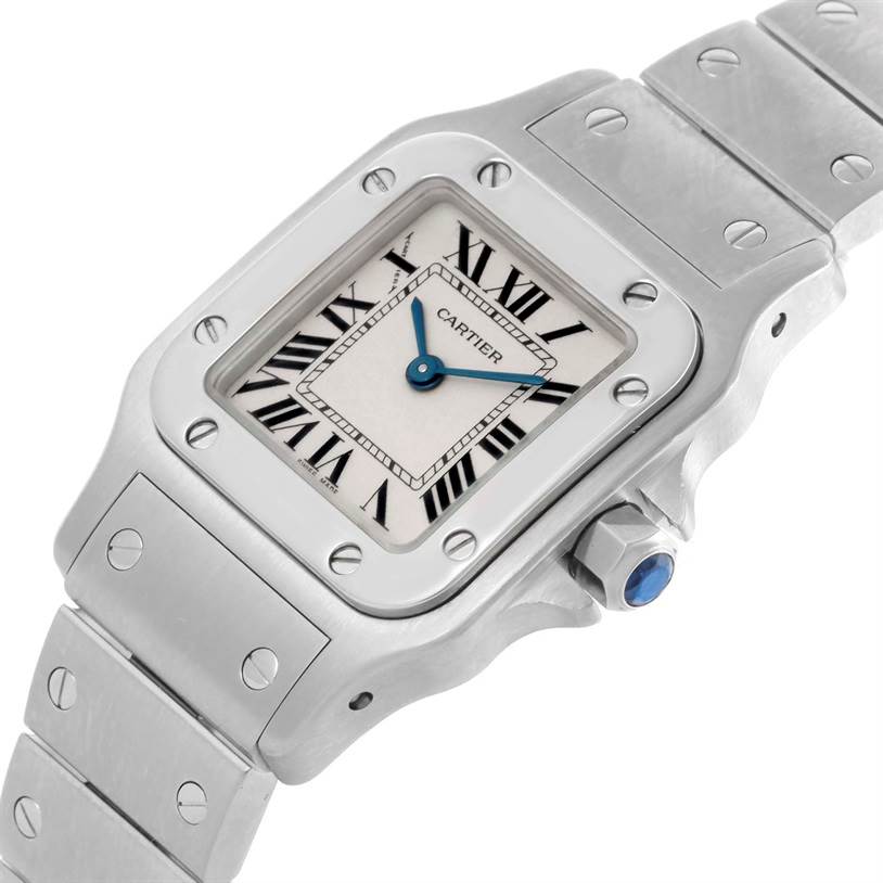 The image shows a close-up of the face and part of the bracelet of a Cartier Santos W20056D6 Women
s Stainless Steel Silver Dial W20056D6 Women
s Stainless Steel Silver Dial watch.