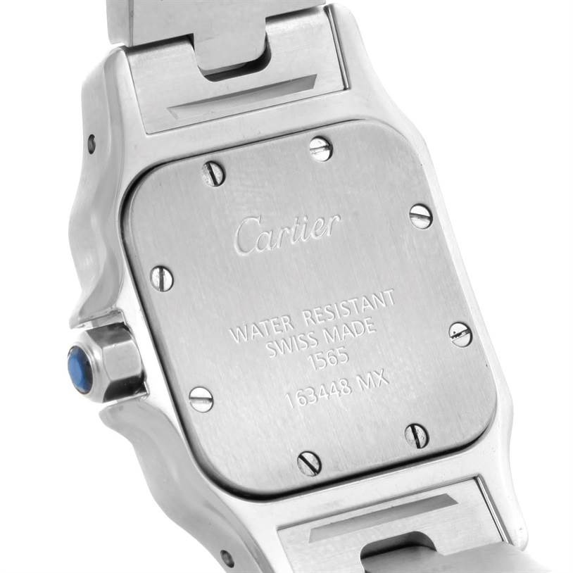 The image shows the back case of the Cartier Santos W20056D6 Women
s Stainless Steel Silver Dial W20056D6 Women
s Stainless Steel Silver Dial watch at an angled view.